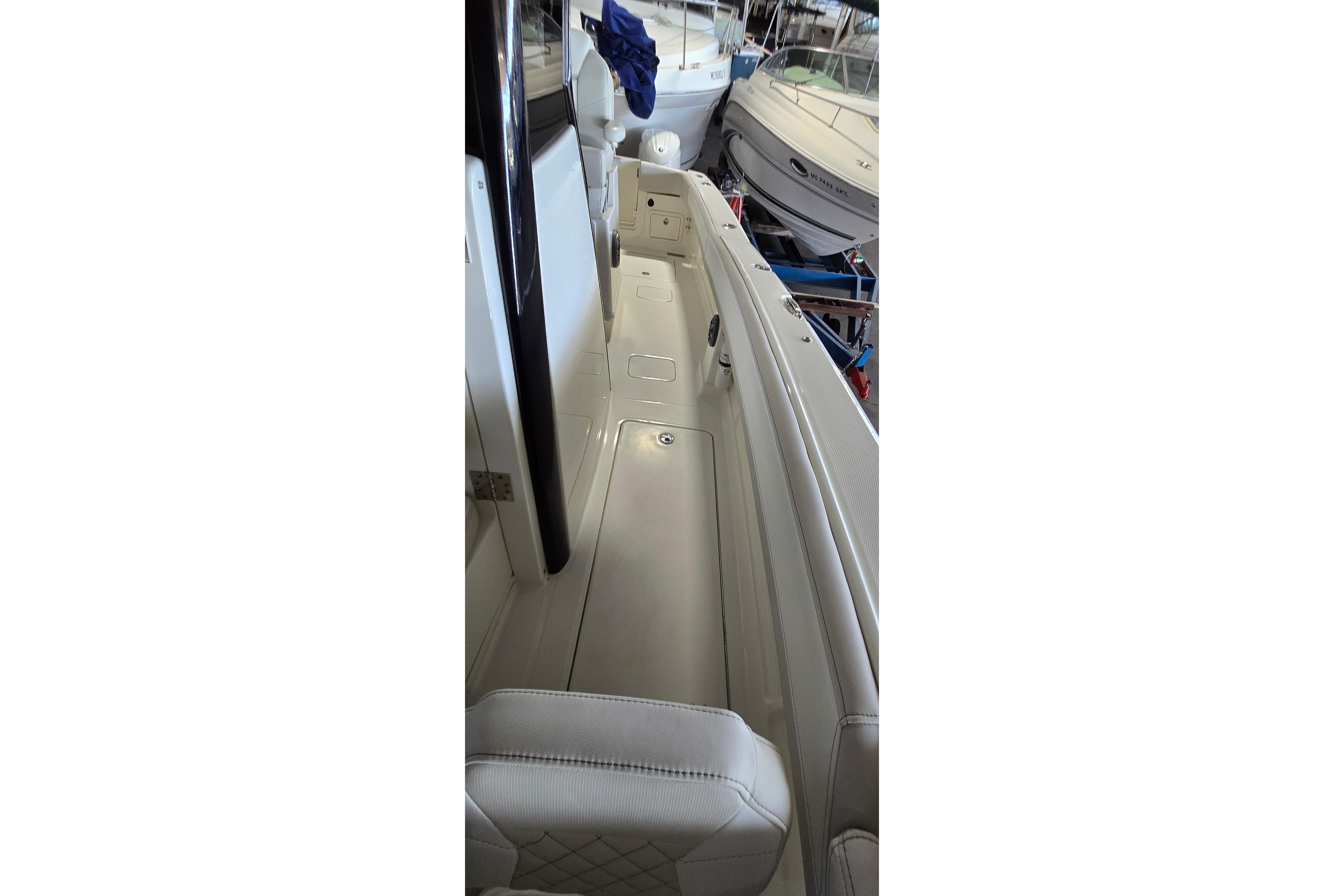 2024 WorldCat 280 CC-X boat interior with white seating and sleek design.