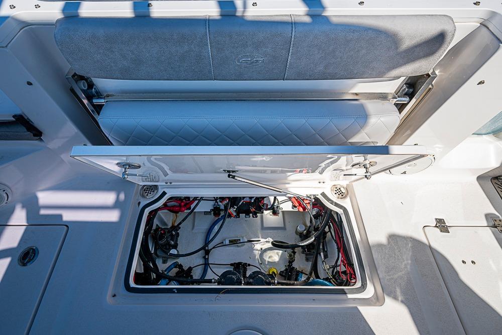 2018 Sea Fox 328 Commander boat storage compartment with open hatch and visible wiring.
