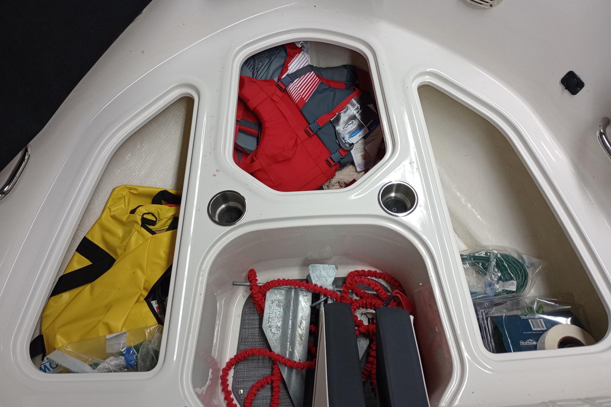 2022 Bayliner VR5 Bowrider I/O storage compartments with life jackets and boating gear.