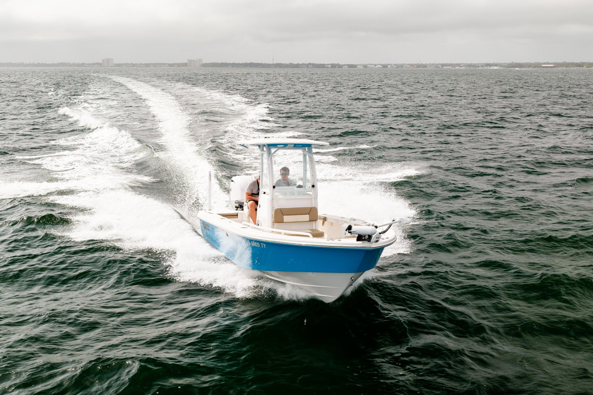 2023 Everglades 243 Center Console boat cruising on open water.