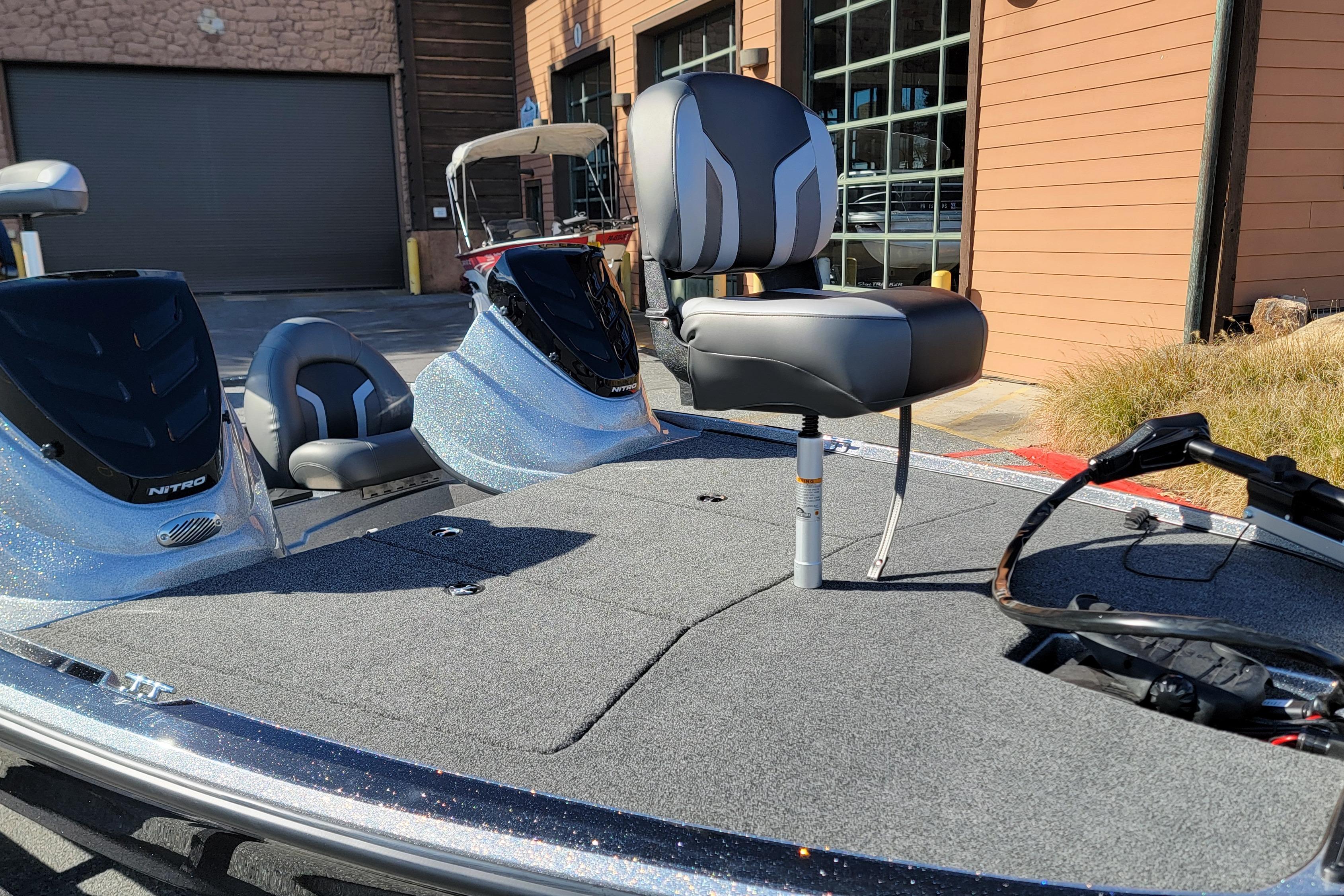 2026 Nitro Z17 boat with sleek design and comfortable seating, parked outside a building.