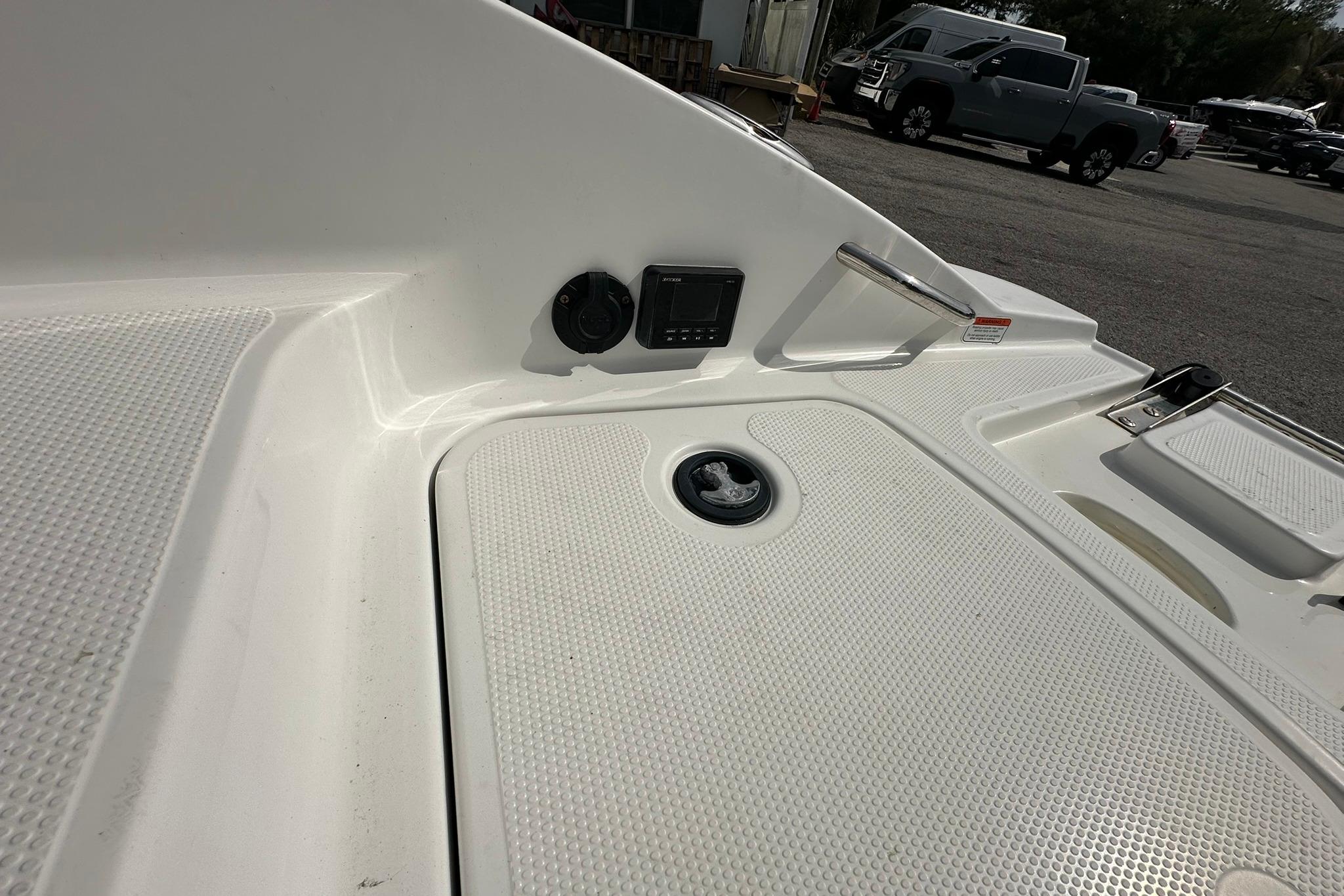 2021 Tahoe 2150 boat deck with textured surface and control panel.