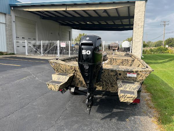 2024 Lowe Roughneck 1660 boat with Mercury 50 outboard motor in camouflage.