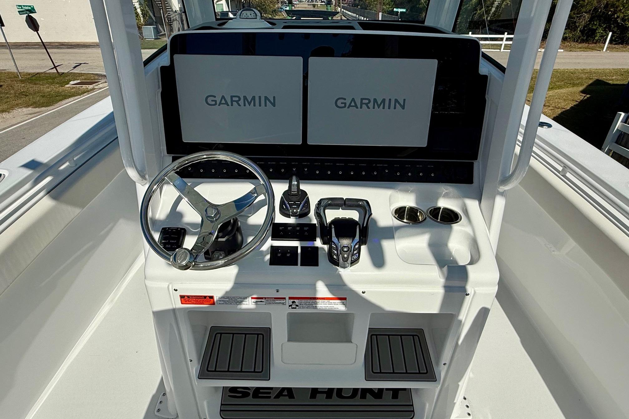 2026 Sea Hunt Gamefish 30 Coffin Box helm with dual Garmin displays and controls.