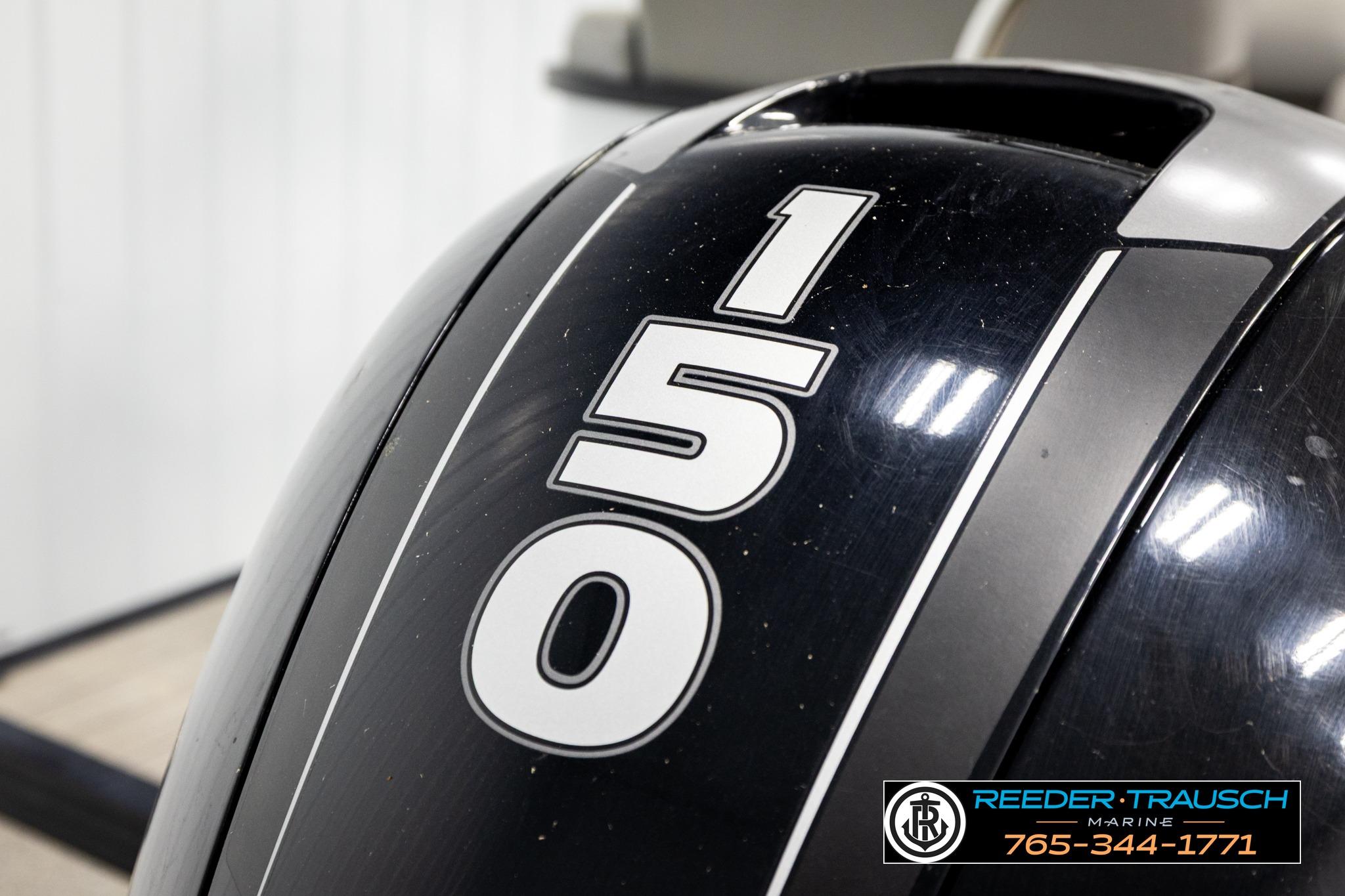 Close-up of 2019 Manitou Oasis SR VP boat engine with '150' marking.