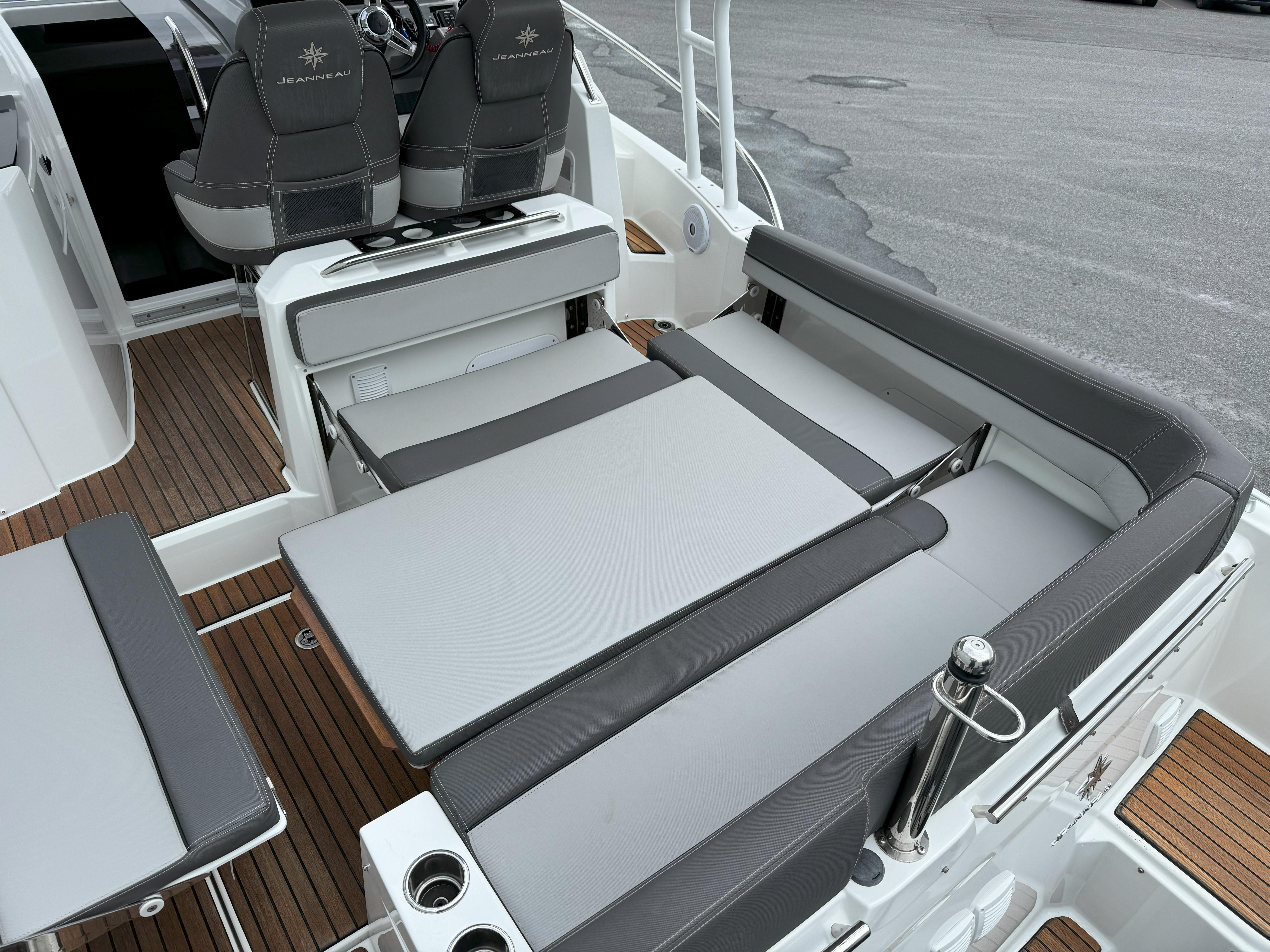 2020 Jeanneau Leader 9.0 WA boat interior with adjustable seating and teak flooring.