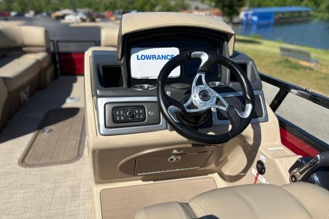 2025 Regency 250 DL3 boat dashboard with steering wheel and Lowrance navigation system.