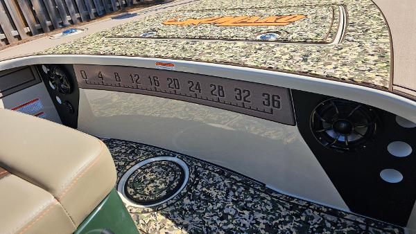 2025 Mako 18 Pro Skiff Backwater Edition interior with camo design and measurement scale.