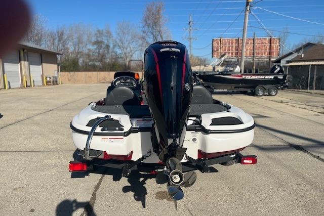 2026 Nitro Z17 boat with outboard motor in a sunny parking lot.