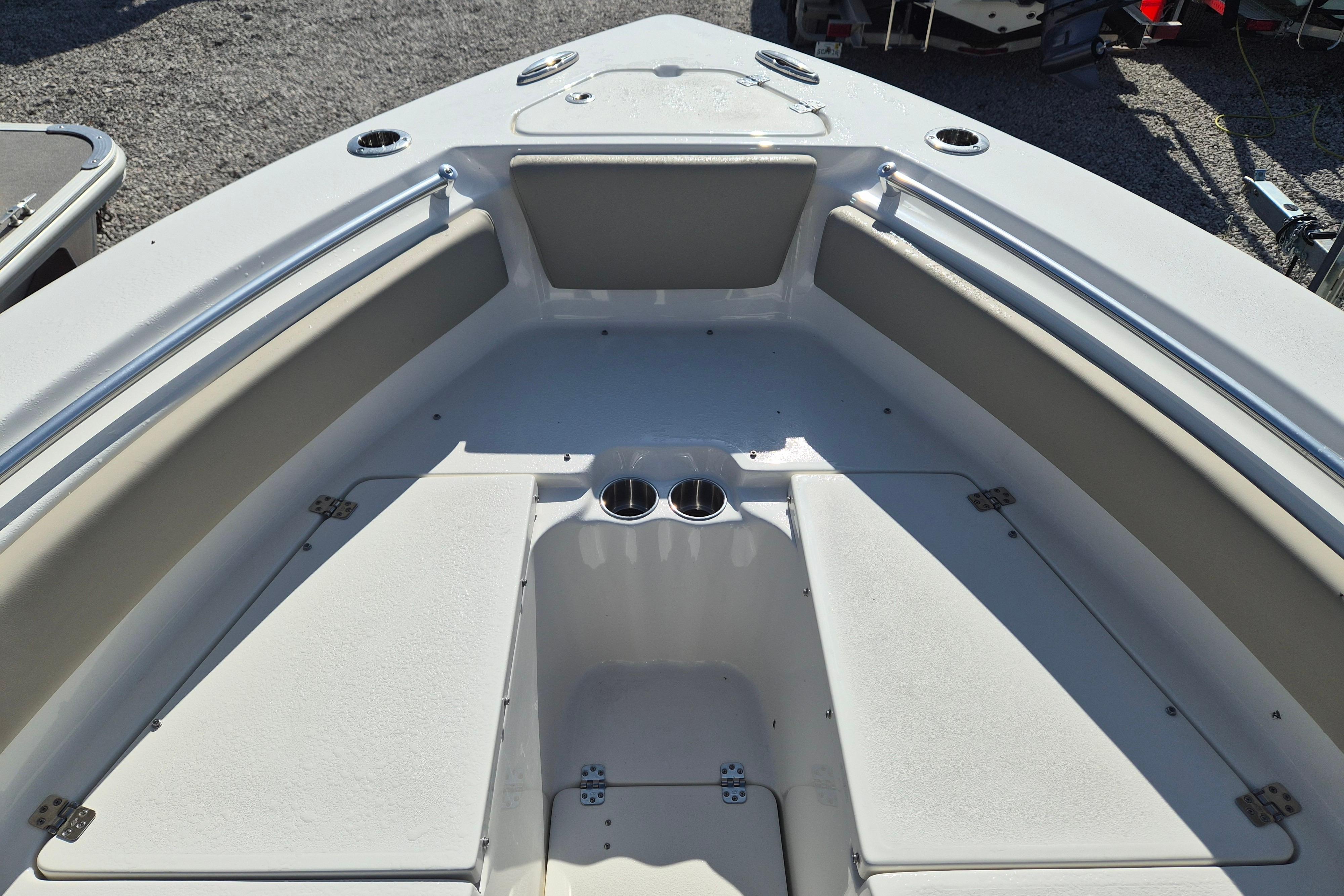 2026 Key West 239 FS boat interior with cushioned seating and cup holders.