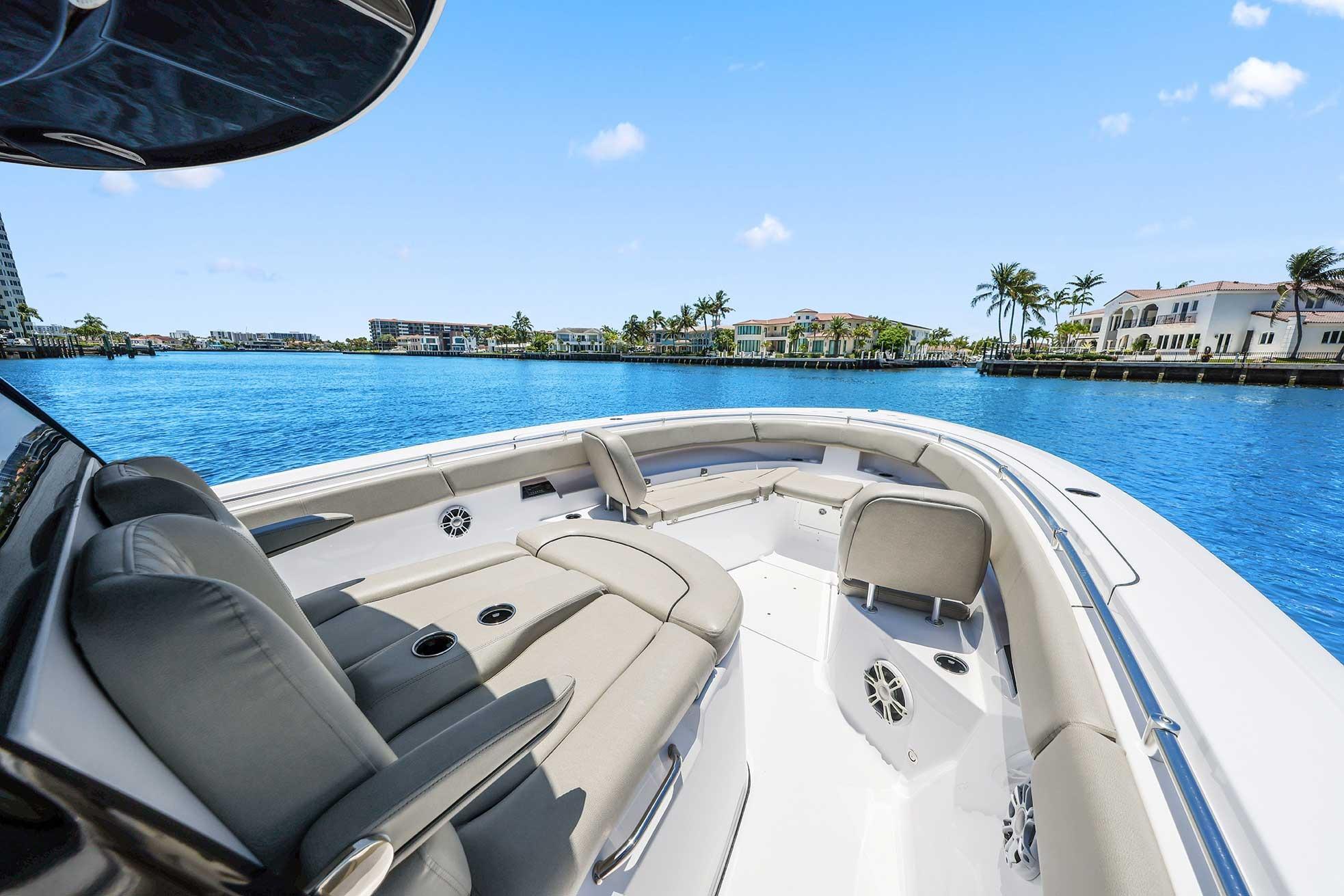 2024 Sportsman Open 352 Center Console boat on serene blue water, luxury seating.
