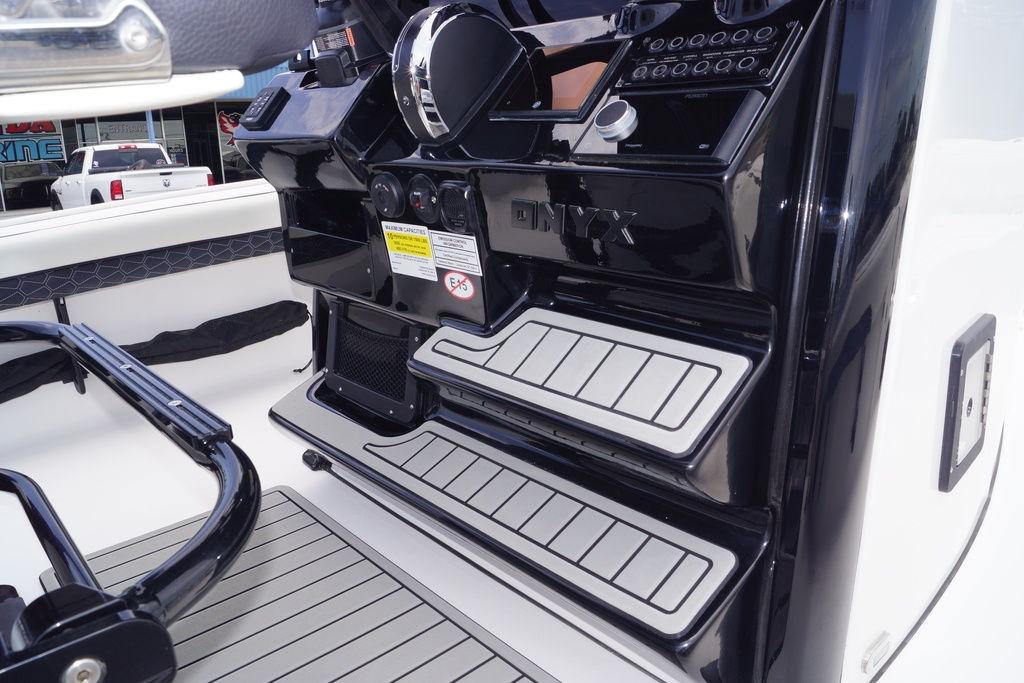 2027 Tidewater 2500 Carolina Bay boat console with sleek black design and modern controls.