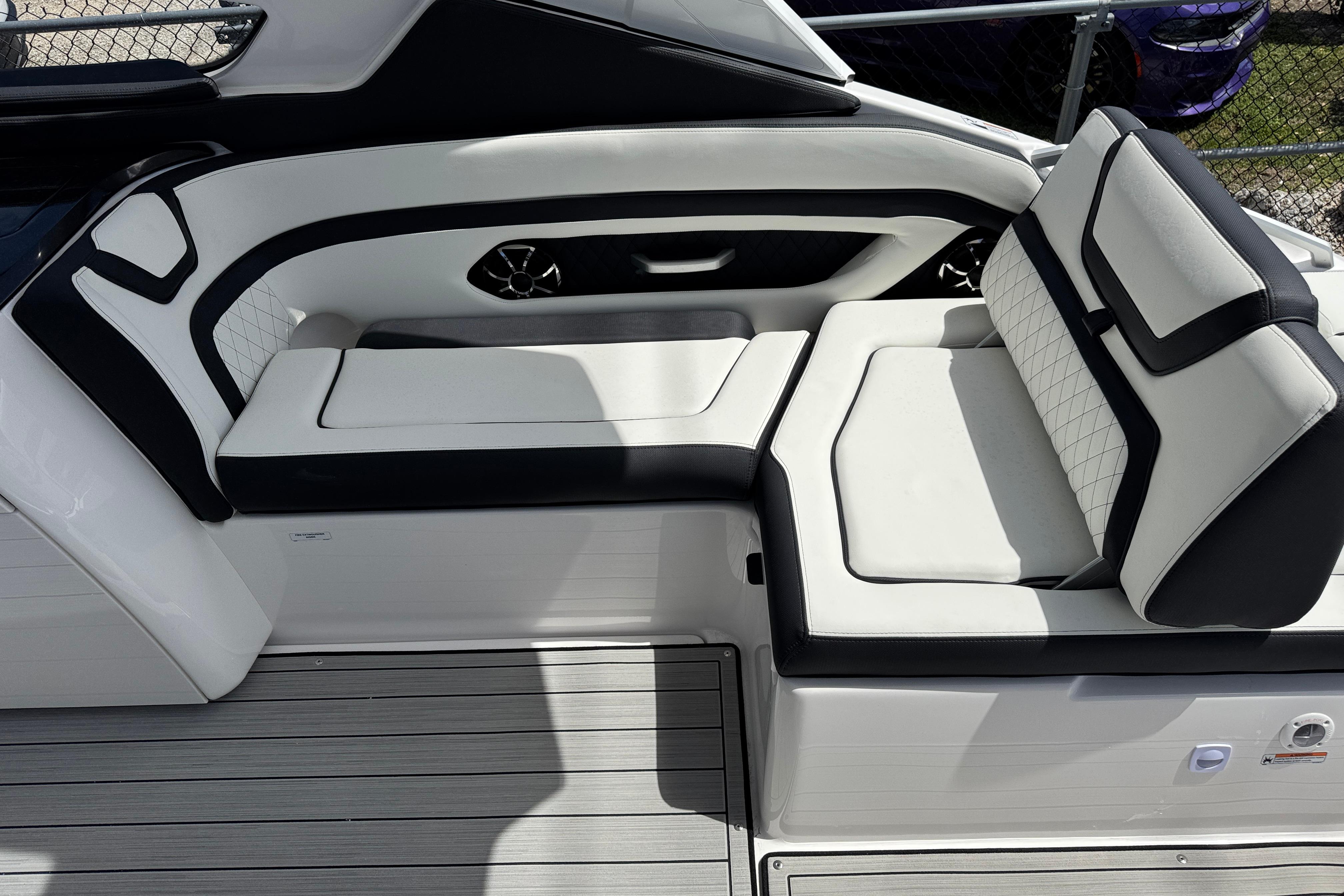 2026 Yamaha Boats 275SD interior seating with sleek black and white design.