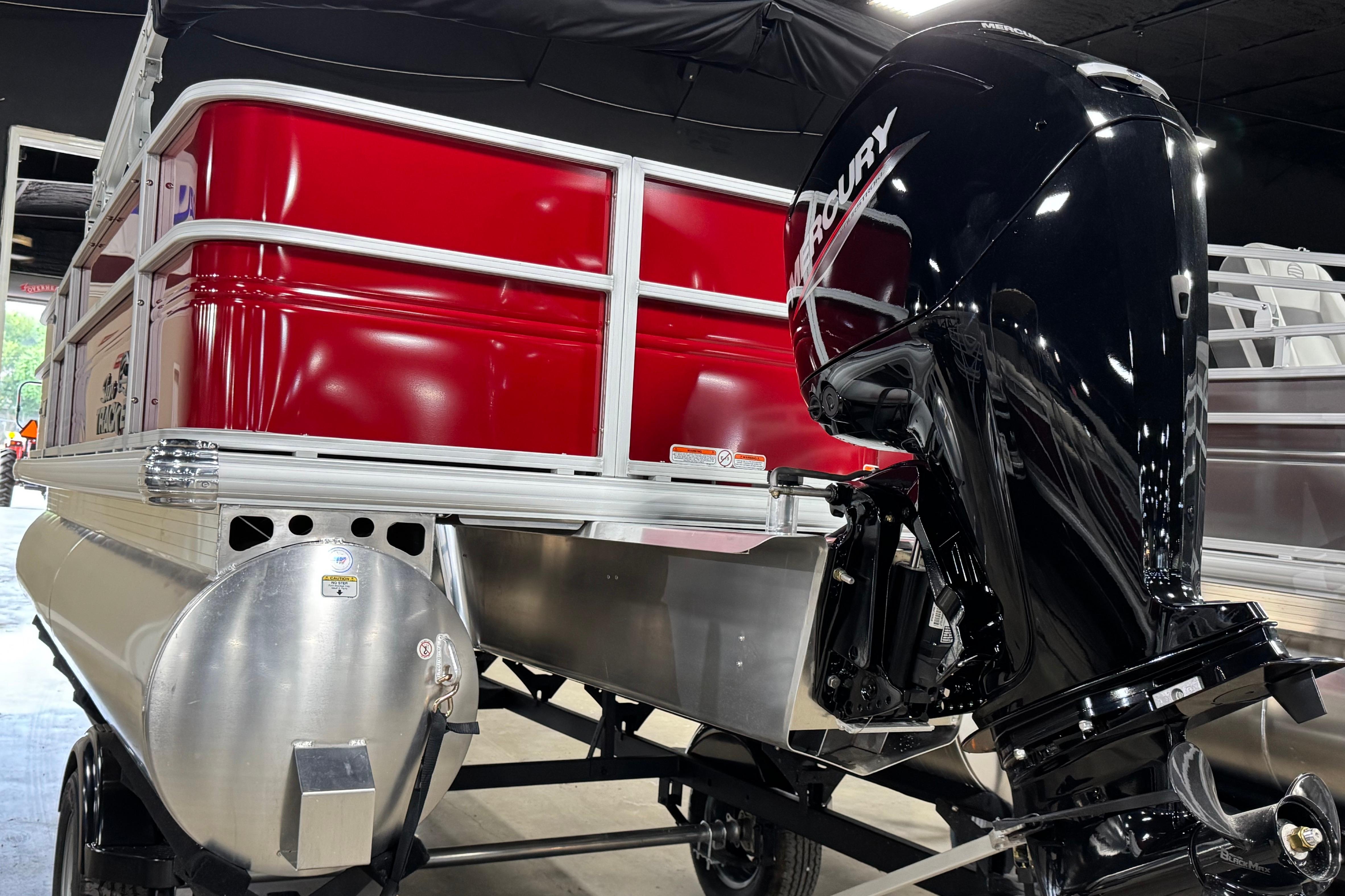 2026 Sun Tracker Party Barge 18 DLX pontoon boat with Mercury outboard motor.