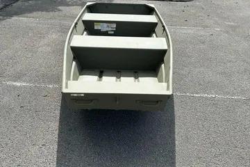 2026 Tracker Grizzly 12 Jon boat on pavement, rear view.