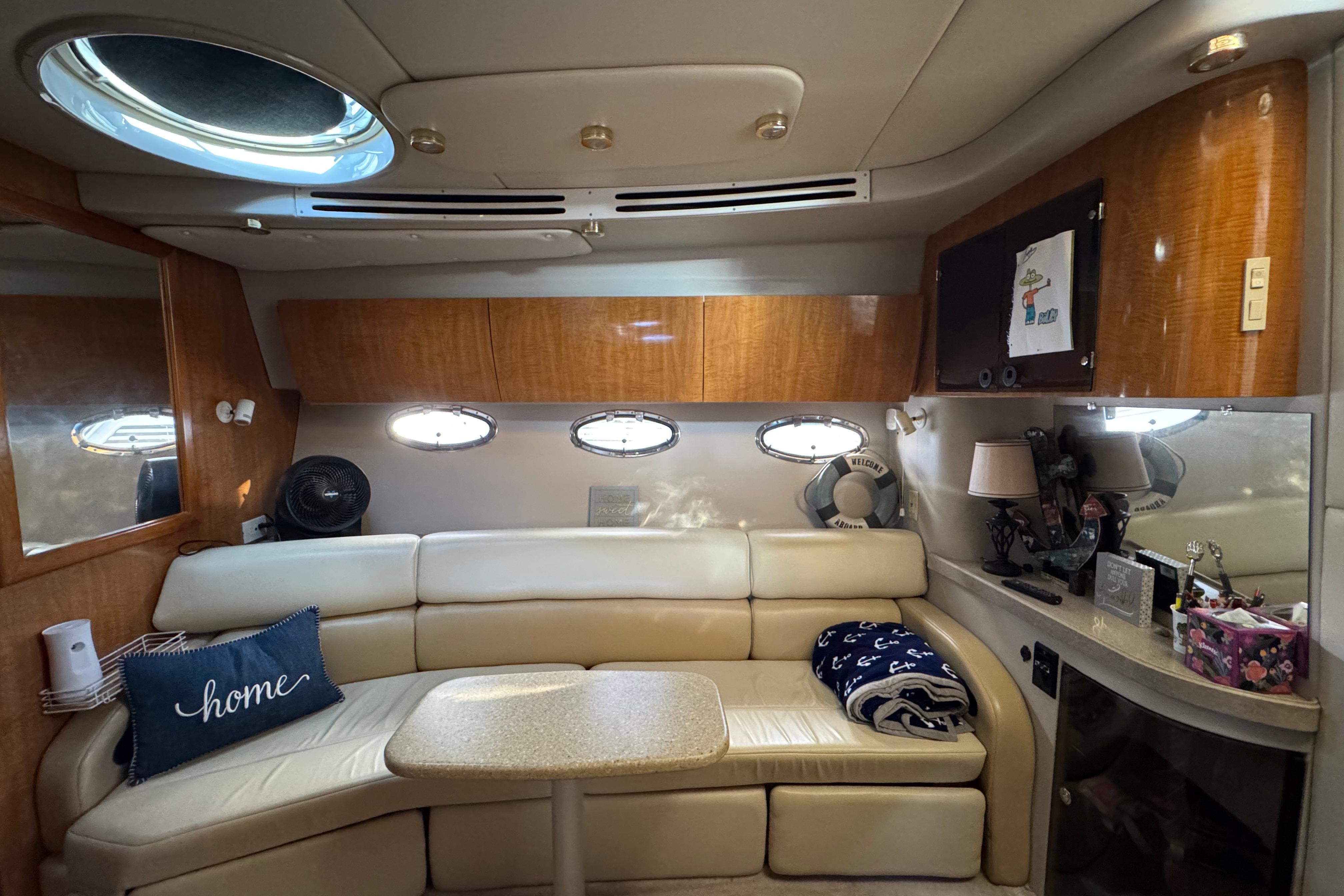 Luxurious interior of 2007 Regal Commodore 3860 yacht with plush seating and elegant decor.