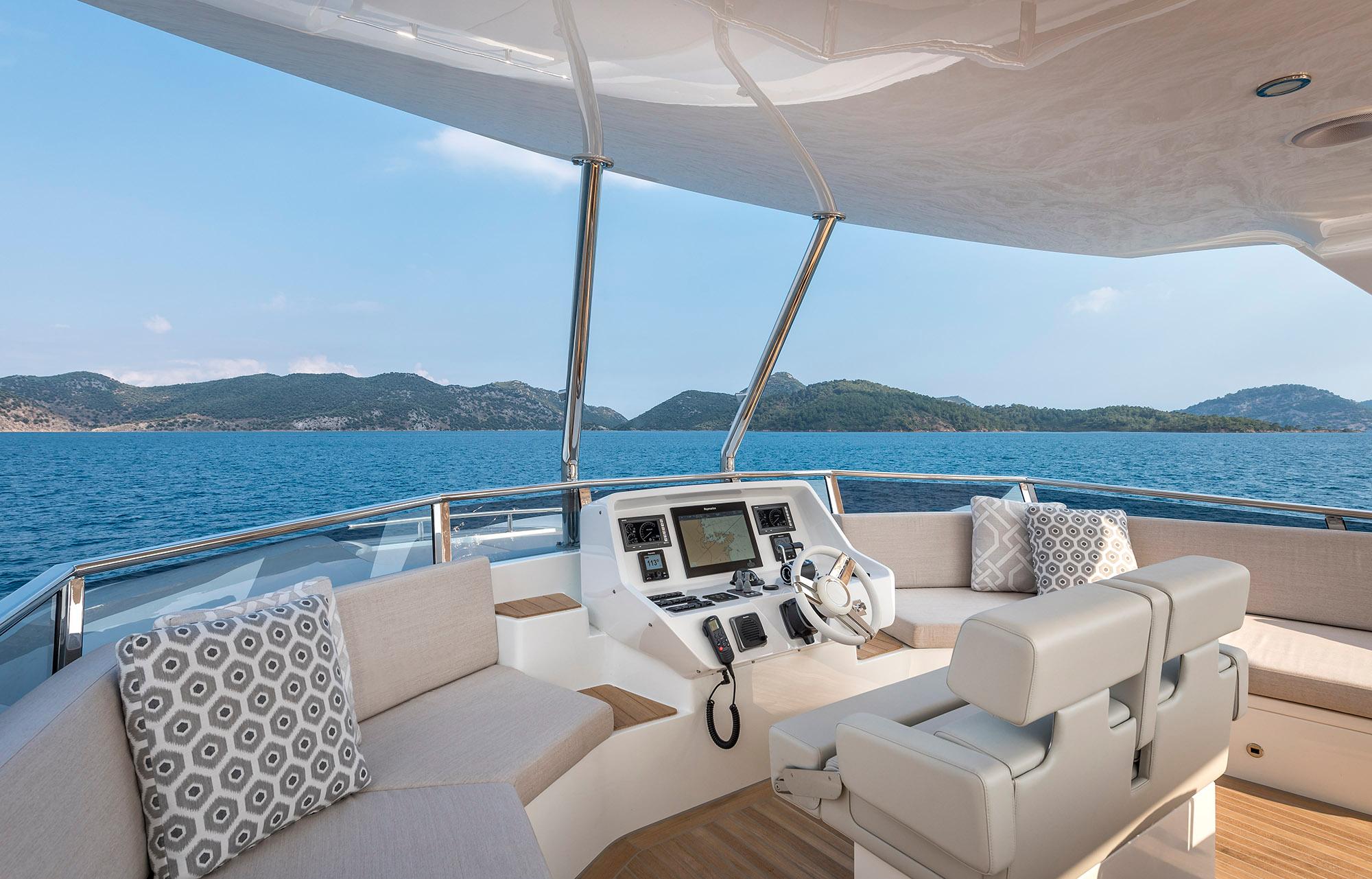 Luxurious 2025 Numarine 26XP yacht interior with scenic ocean view.