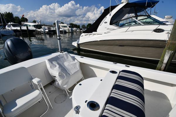 2021 Eastern 248 Center Console boat docked at a marina with other boats.