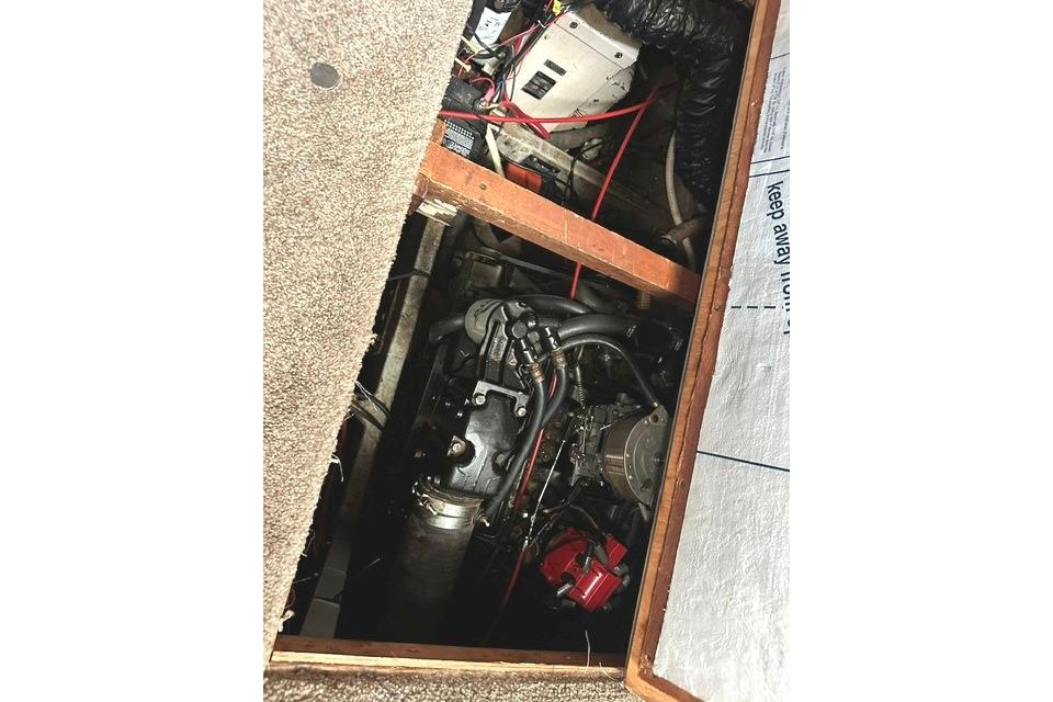 Engine compartment of 1989 Carver 32 Aft Cabin Motor Yacht, showing mechanical components.