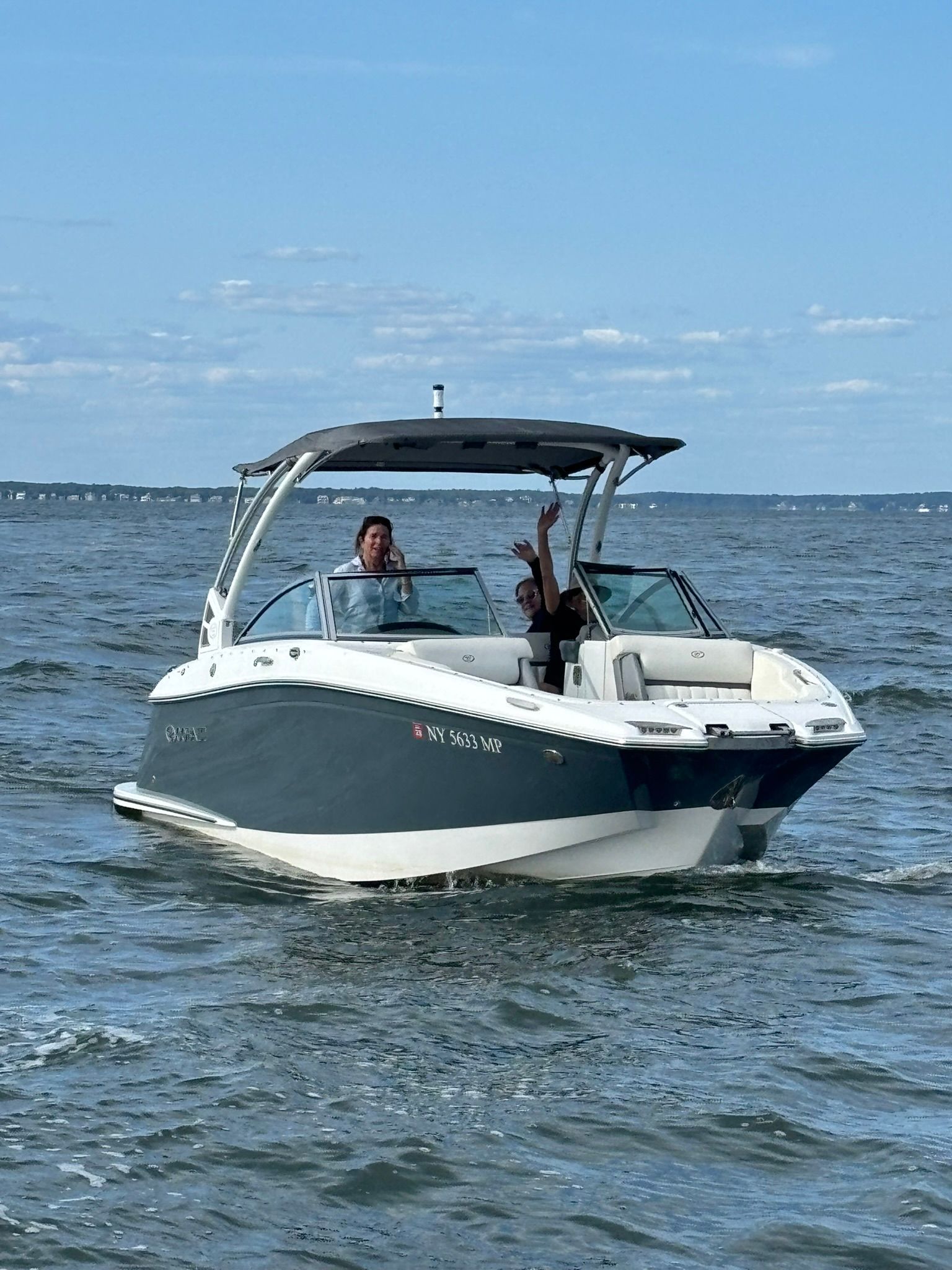 2020 Cobalt SC23 boat on water with two people aboard.