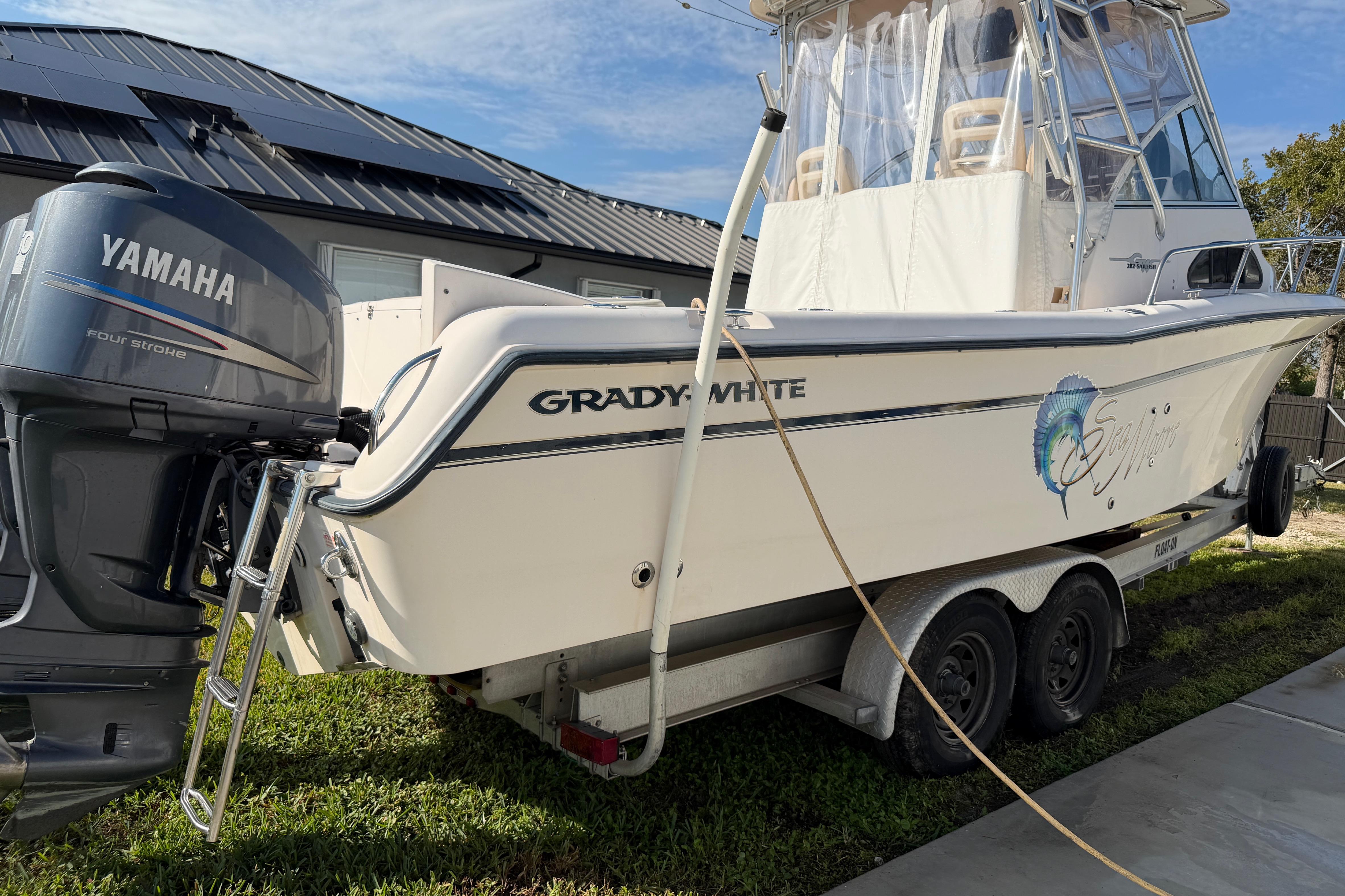 2006 Grady-White Sailfish 282 boat on trailer with Yamaha outboard motor.