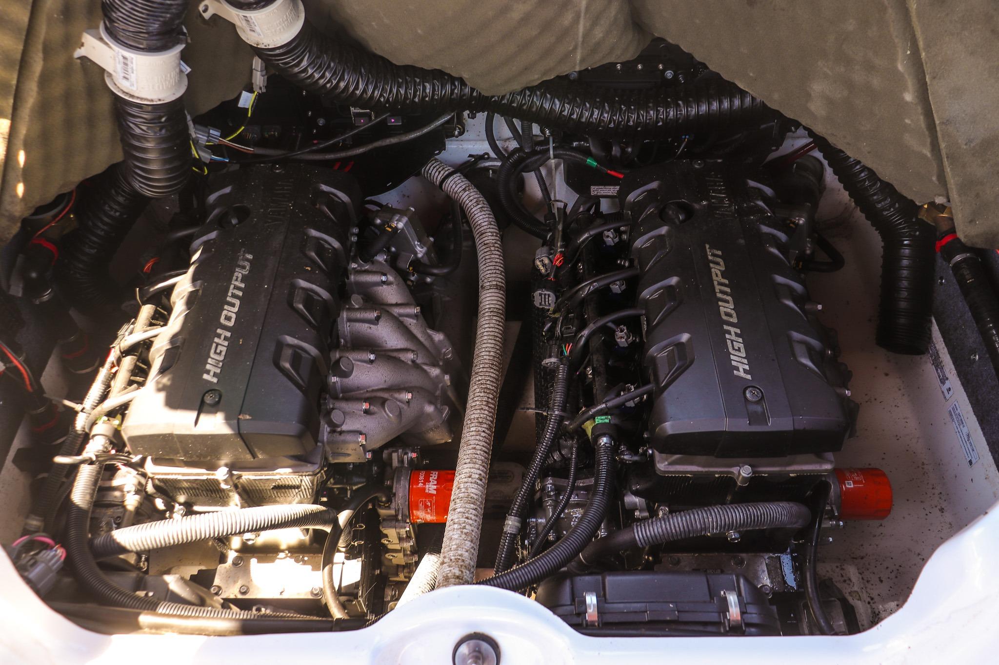 Engine compartment of a 2020 Yamaha Boats 242X, featuring dual high-output engines.