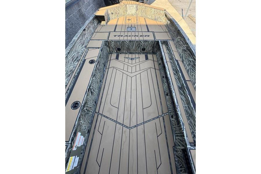 2026 Tracker Grizzly 1756 T Marsh boat interior with camo design and spacious deck.