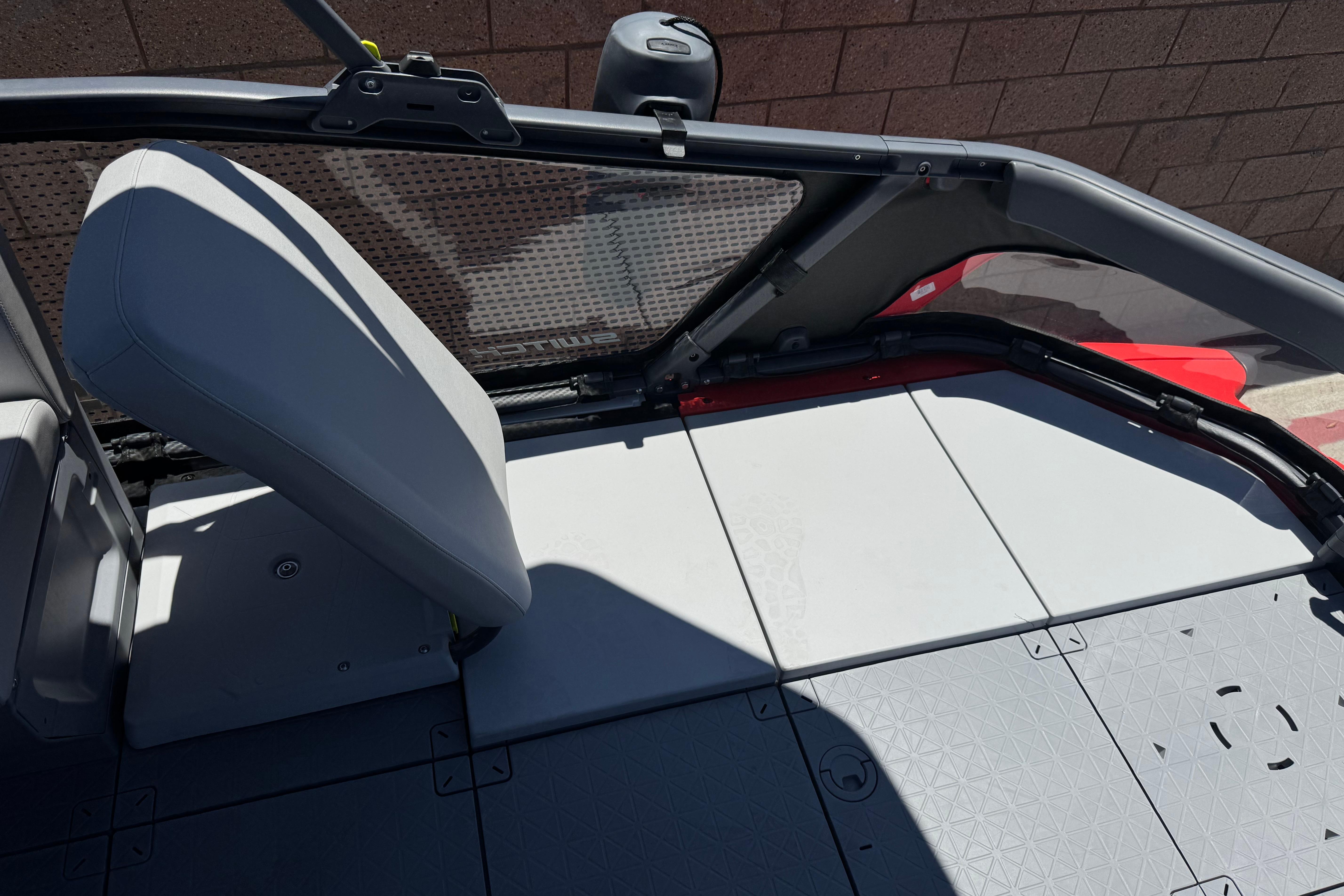 2024 Sea-Doo Switch Compact interior with modular seating and textured flooring.