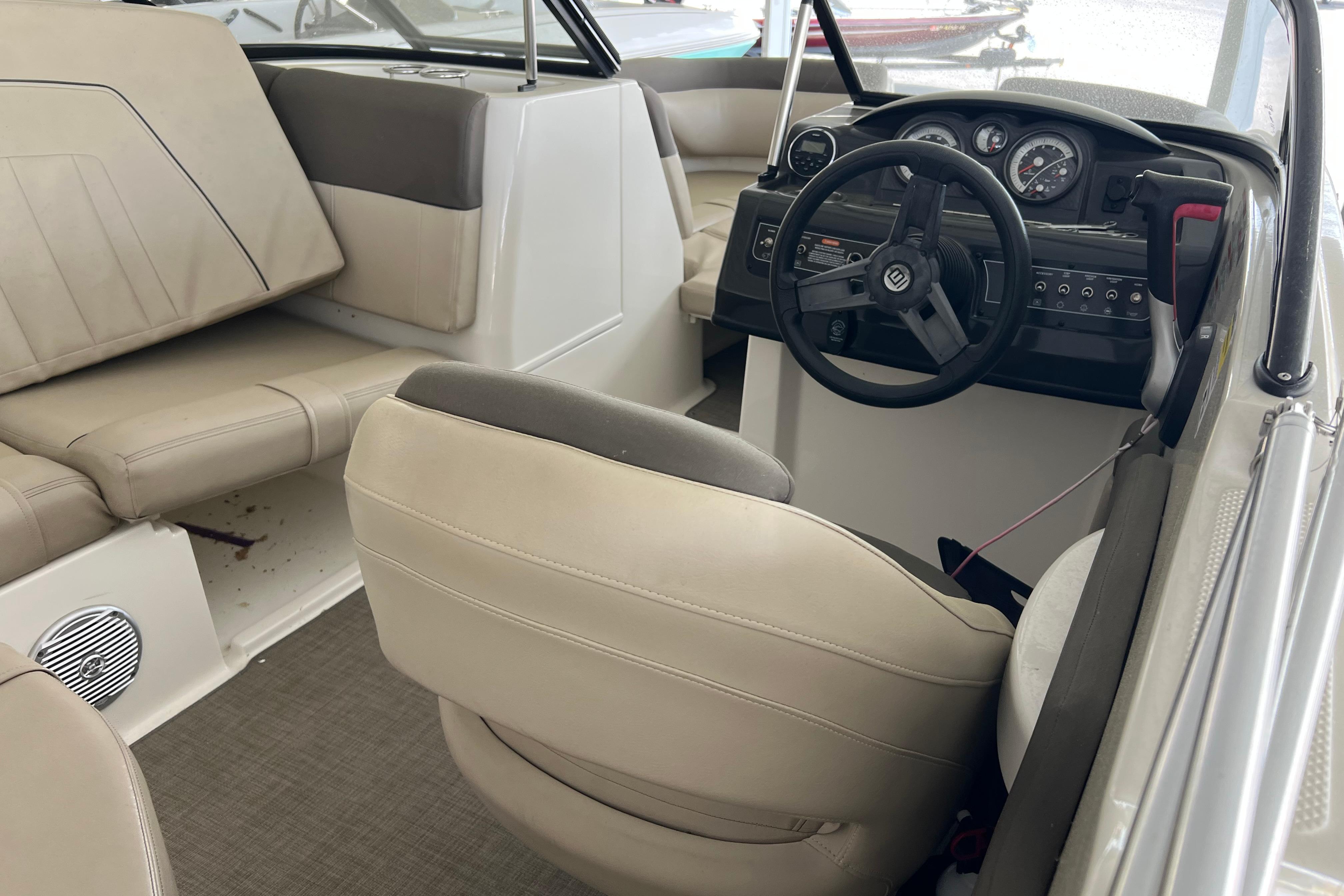 Interior of a 2017 Bayliner 195 Deck Boat featuring steering wheel and seating.