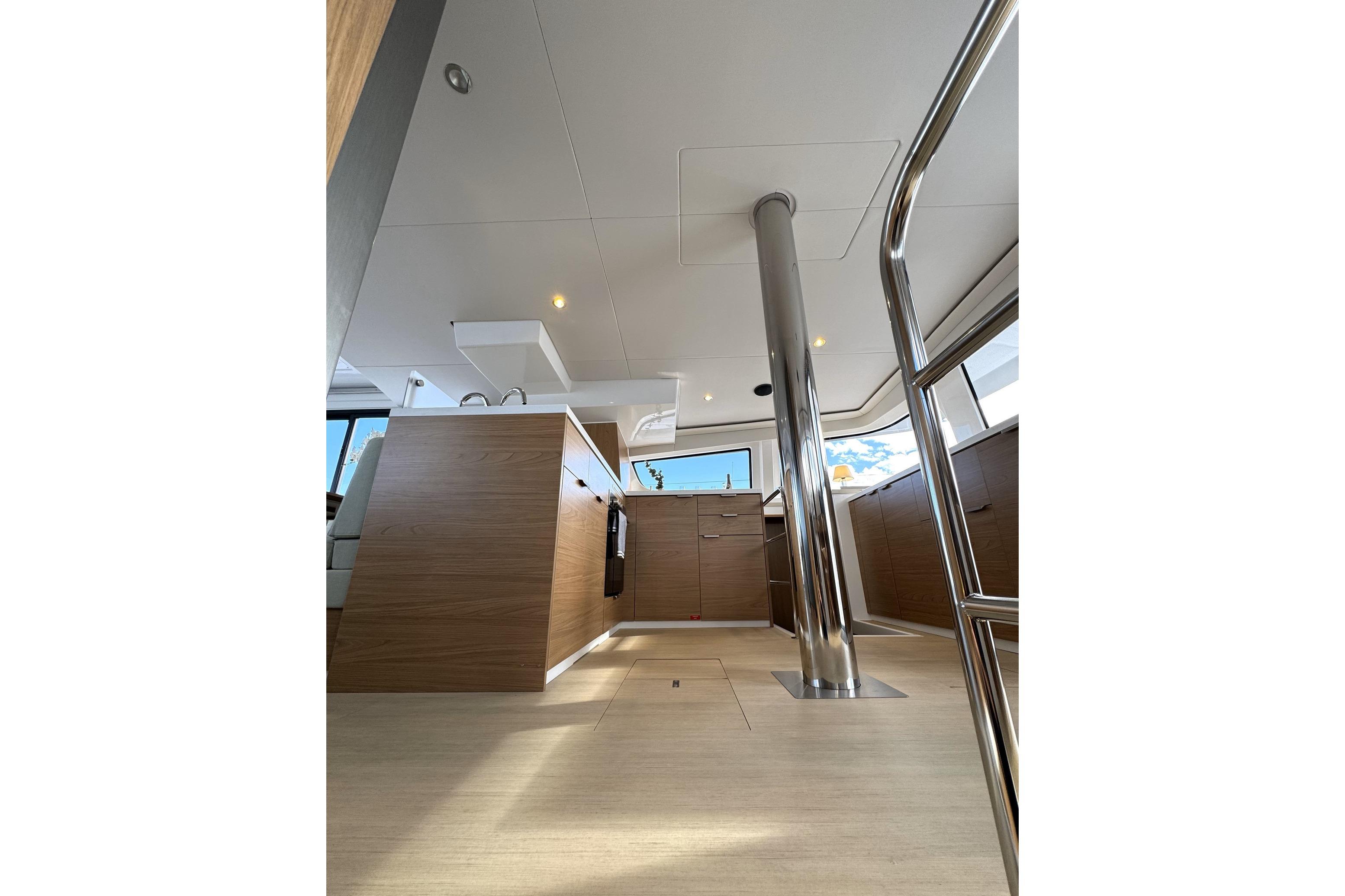Modern interior of 2024 Bali 4.6 yacht, featuring sleek wood finishes and stainless steel elements.