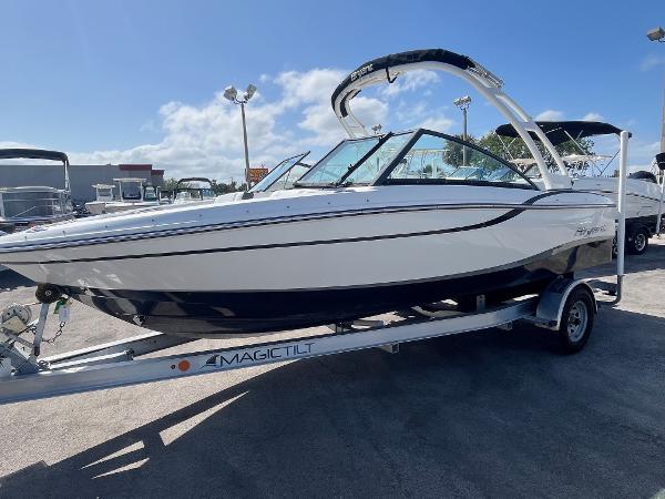 2018 Bryant Speranza boat on Magic Tilt trailer under clear blue sky.