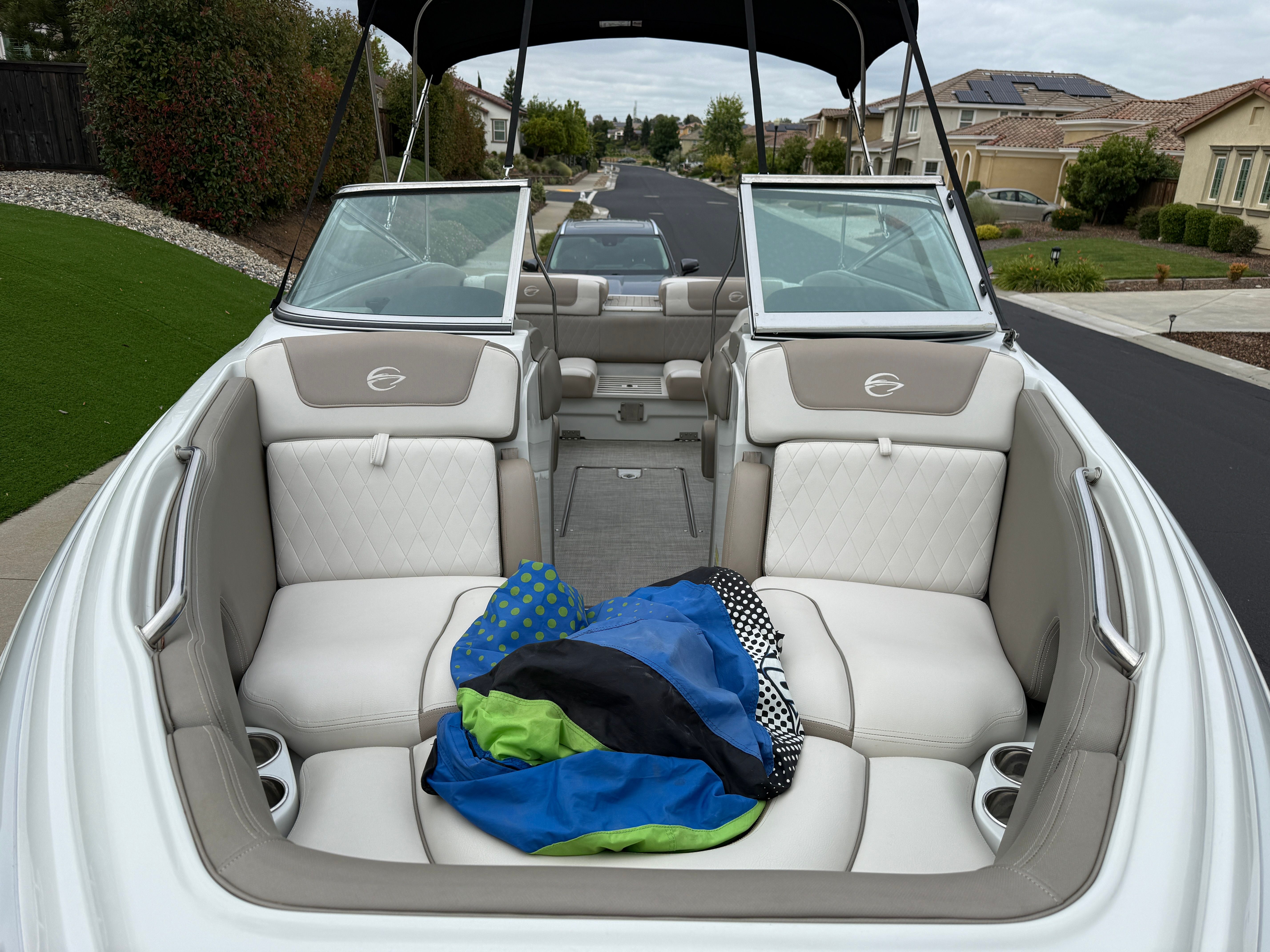 Interior of a 2019 Crownline 235 SS boat parked on a street.