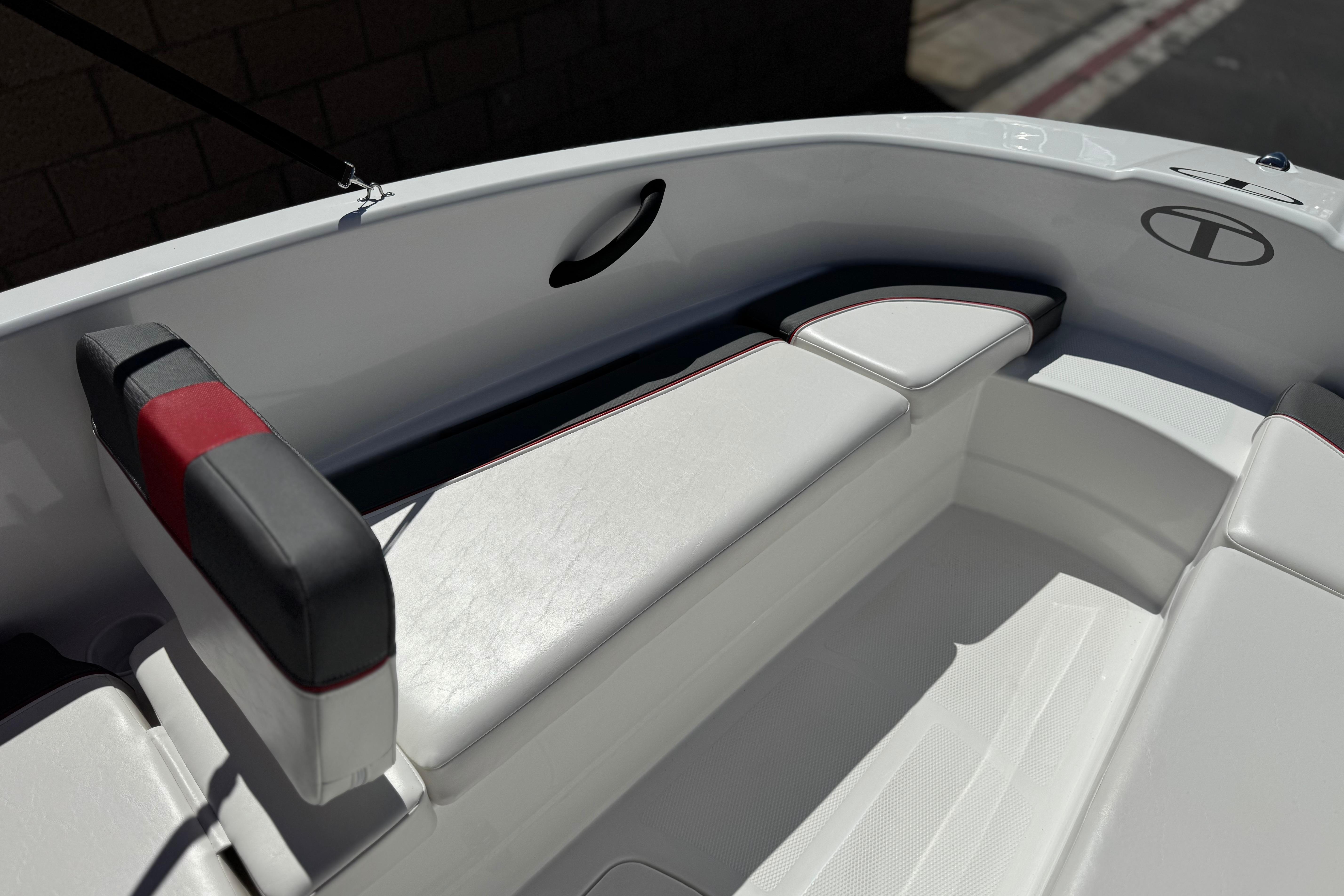 2024 Tahoe T16 boat interior with white and black seating, featuring red accents.