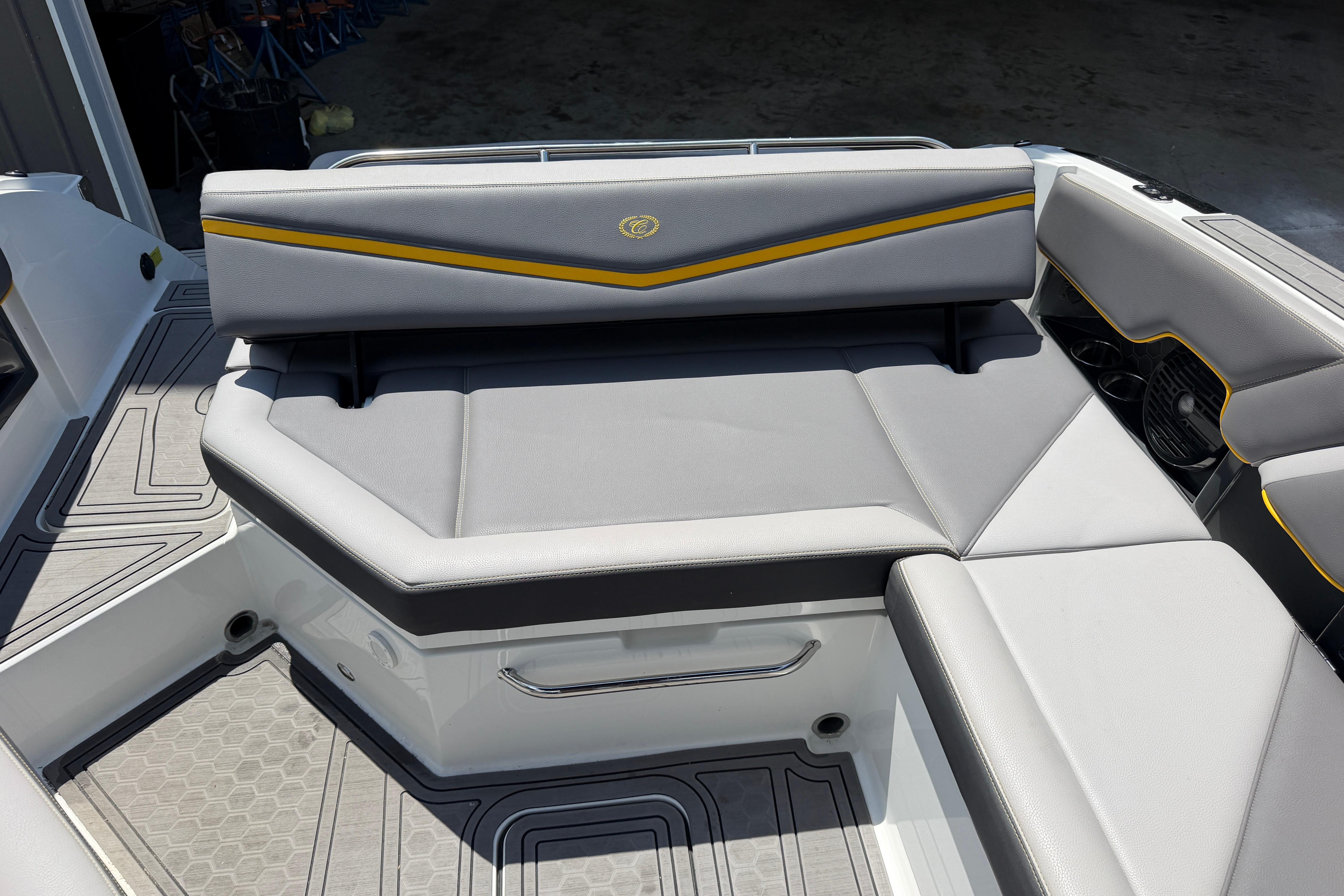 2021 Cobalt R8 Surf boat interior with gray seating and yellow accents.