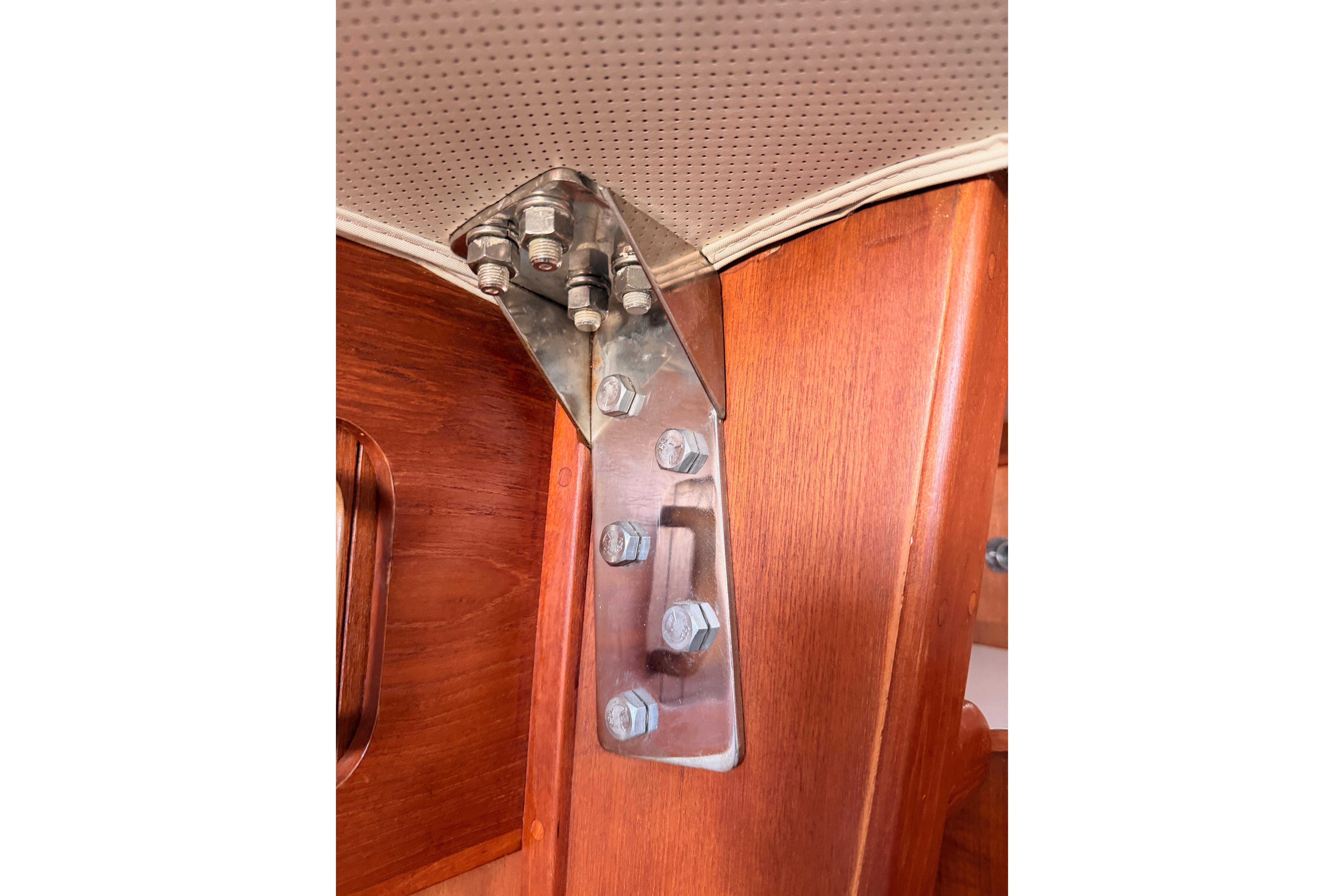 Stainless steel bracket on wooden interior of 1991 Caliber 33 boat.