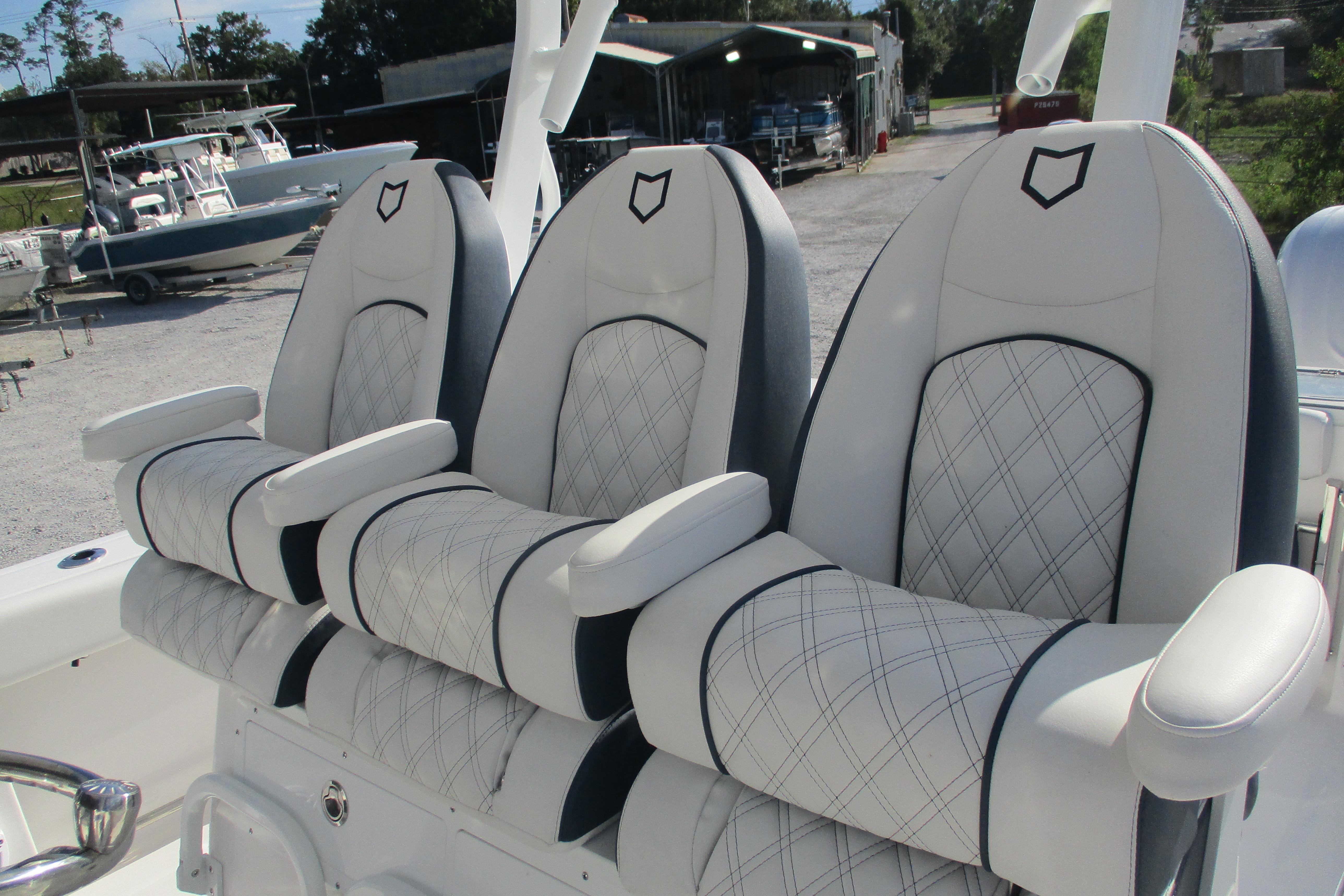 Luxury seating on 2026 Sea Fox 328 Commander boat, featuring elegant white upholstery.