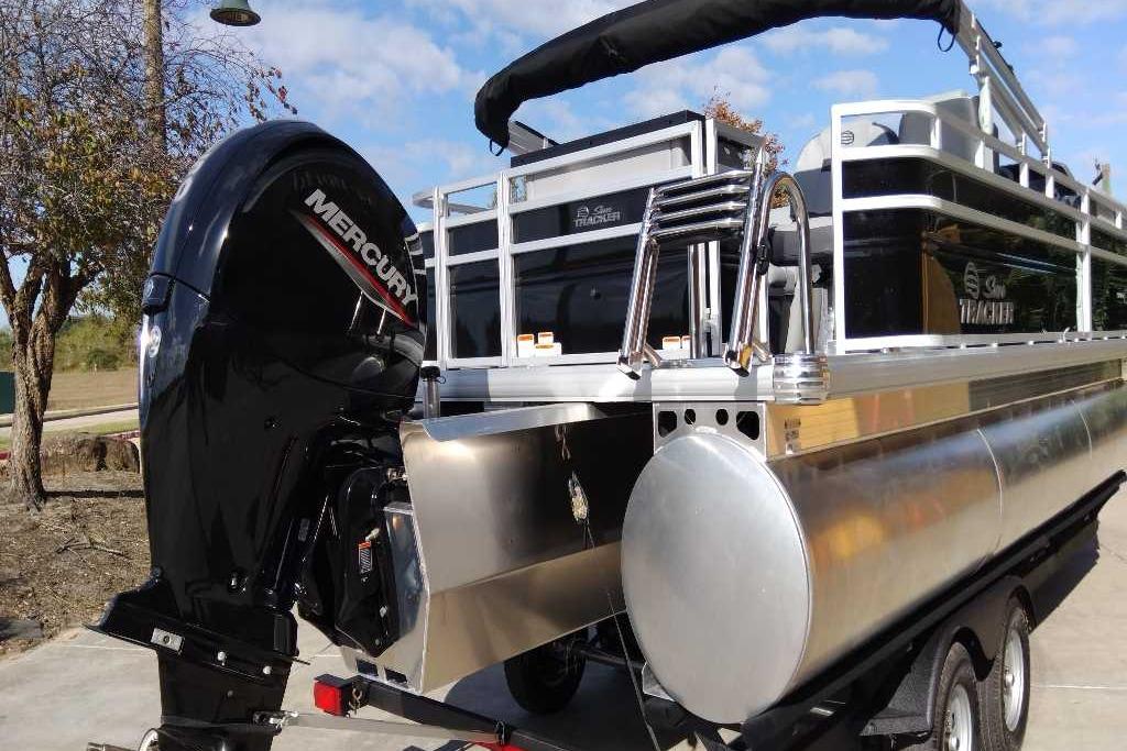 2026 Sun Tracker SportFish 22 XP3 pontoon boat with Mercury outboard motor.