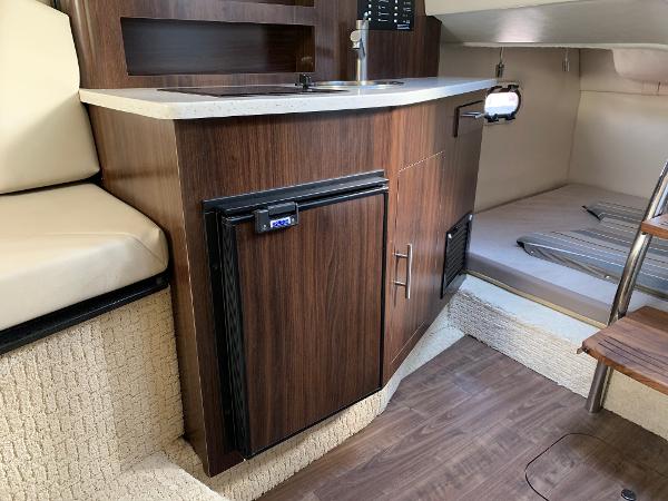 Interior of the 2017 Regal 26 Express with kitchenette and sleeping area.