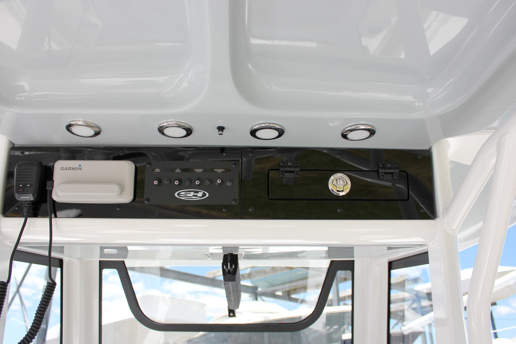 2027 Sea Hunt Ultra 275 SE dashboard with Garmin device and control panel.