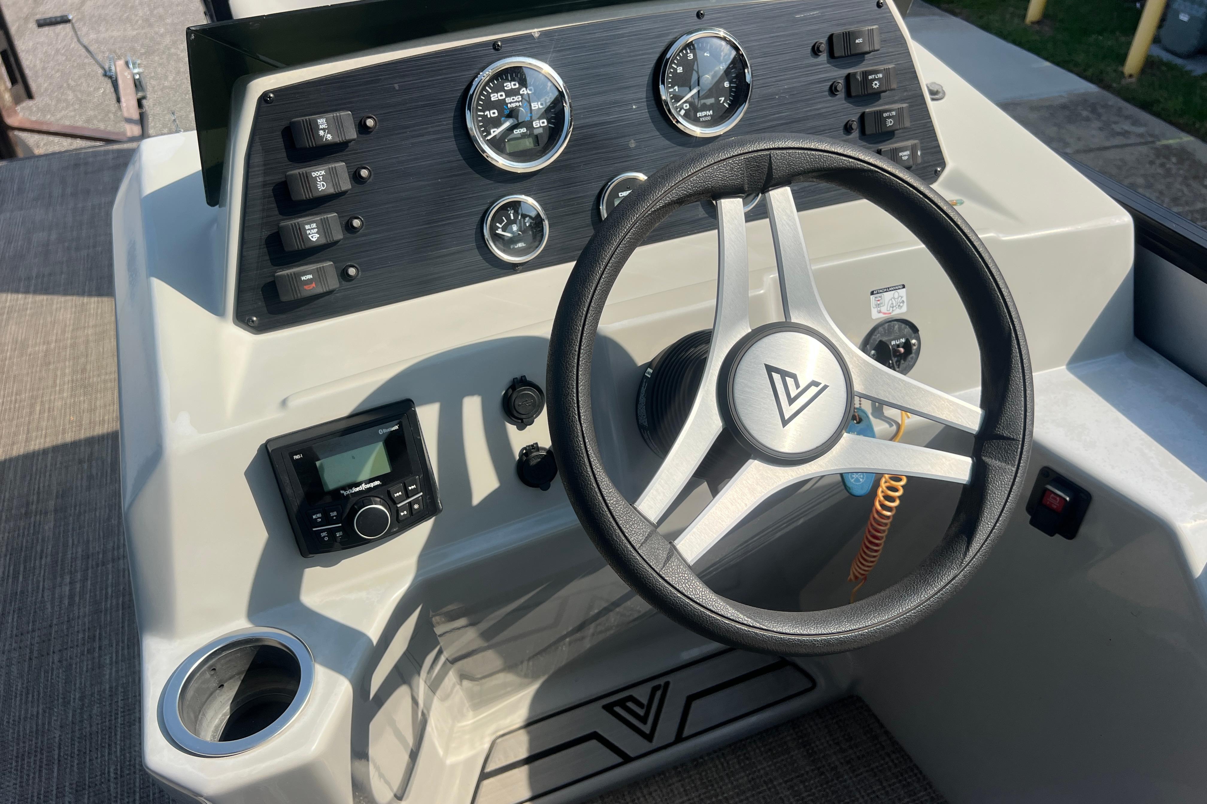 Steering console of 2022 Viaggio Lago V-U 22 boat with gauges and controls.