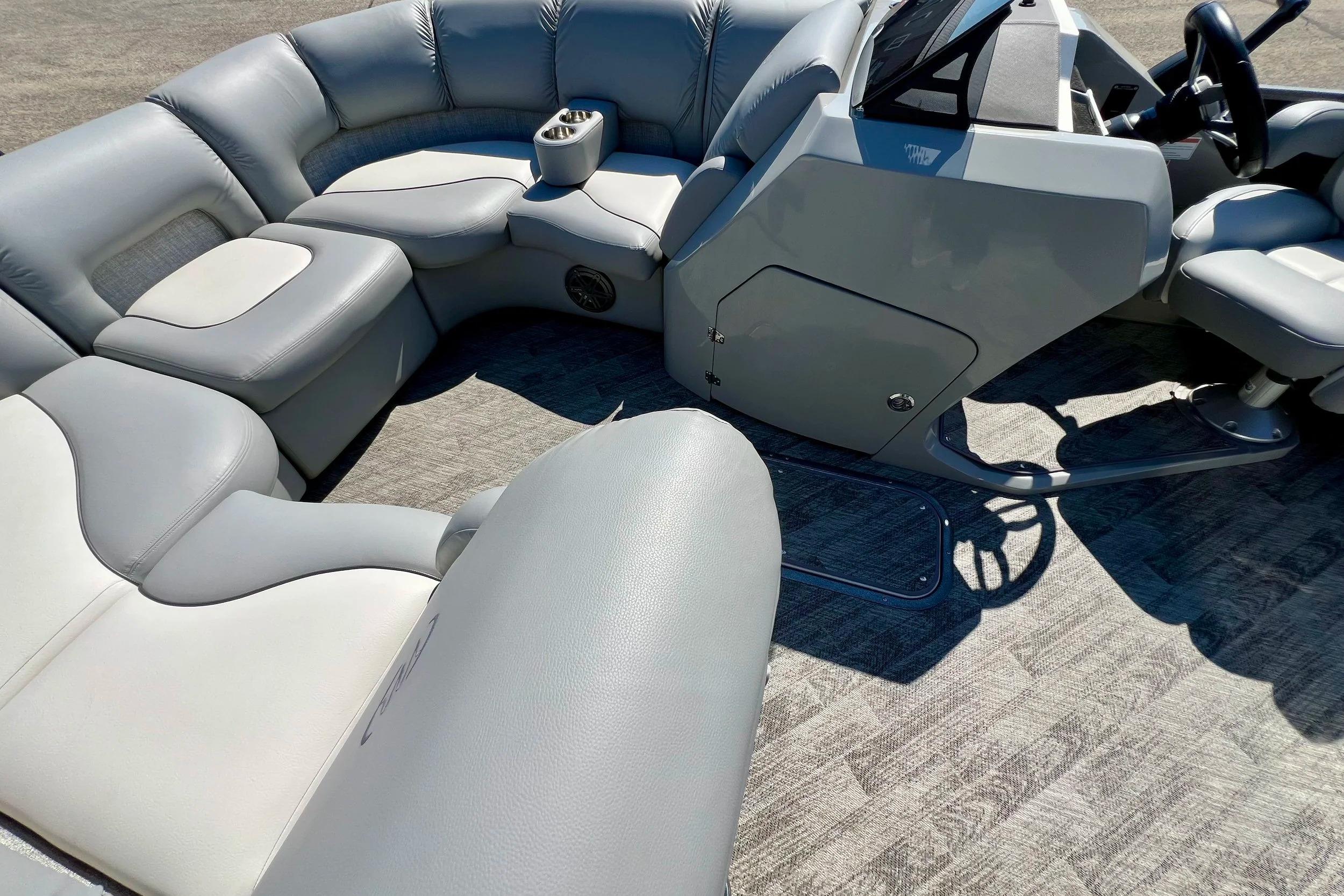2018 Manitou MD 25 TriToon interior with plush seating and modern helm.