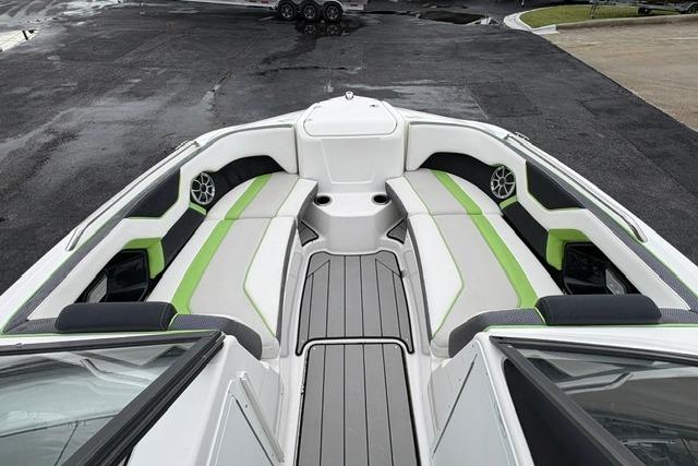 2021 Yamaha Boats 212XD interior with green-accented seating and modern design.