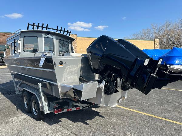 2024 Spartan 260 Maximus Pro XL boat on a trailer with dual outboard motors.