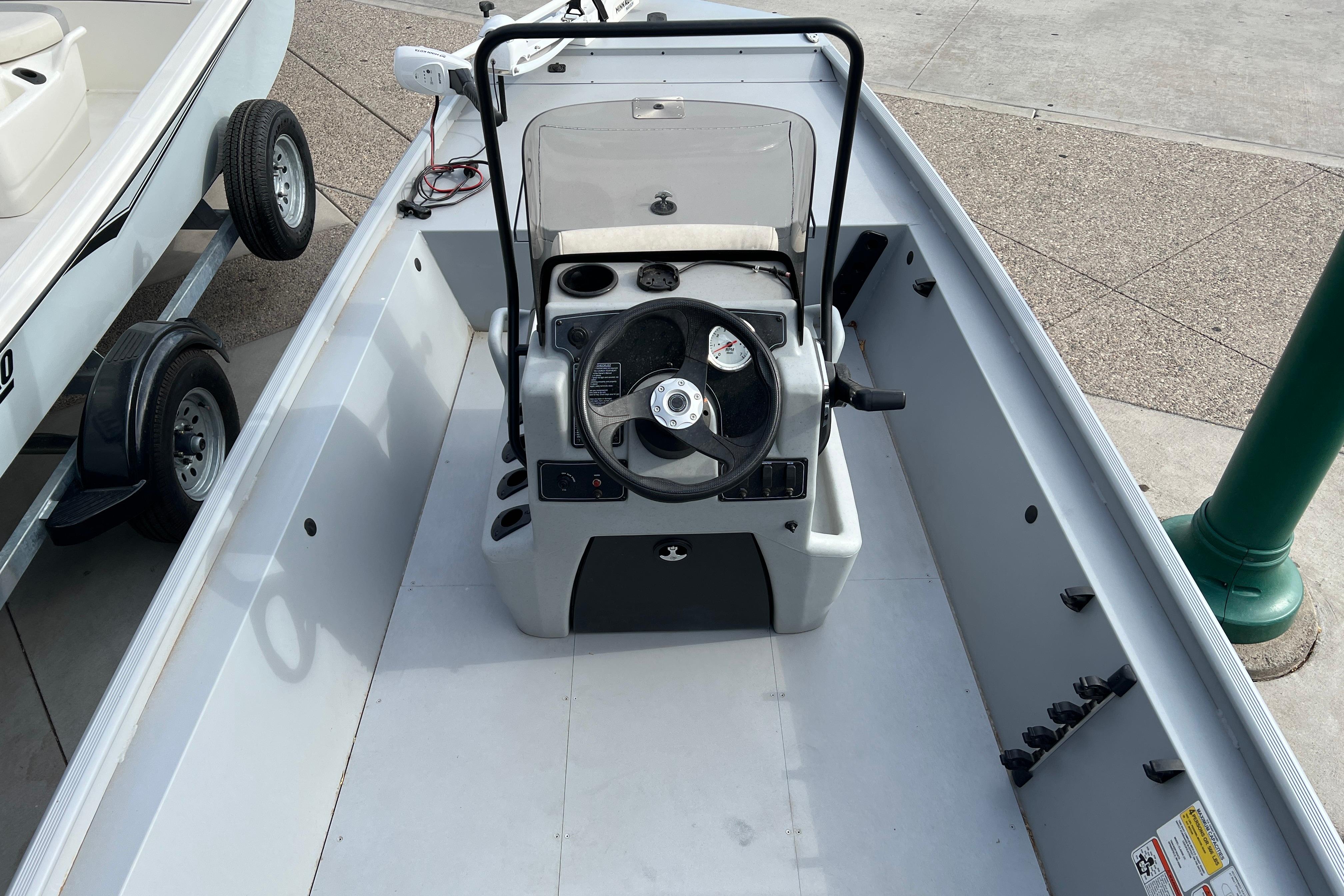 2026 Tracker Bass Tracker Classic CC boat interior with steering console and seating.