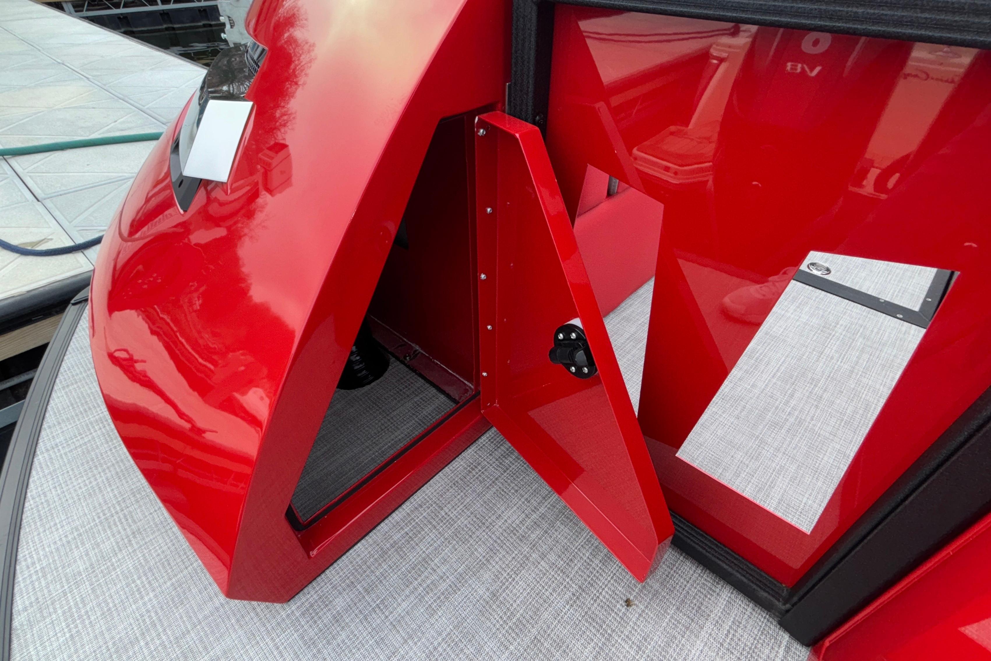 2025 Montara 25 Surf Boss, vibrant red exterior detail, open compartment view.