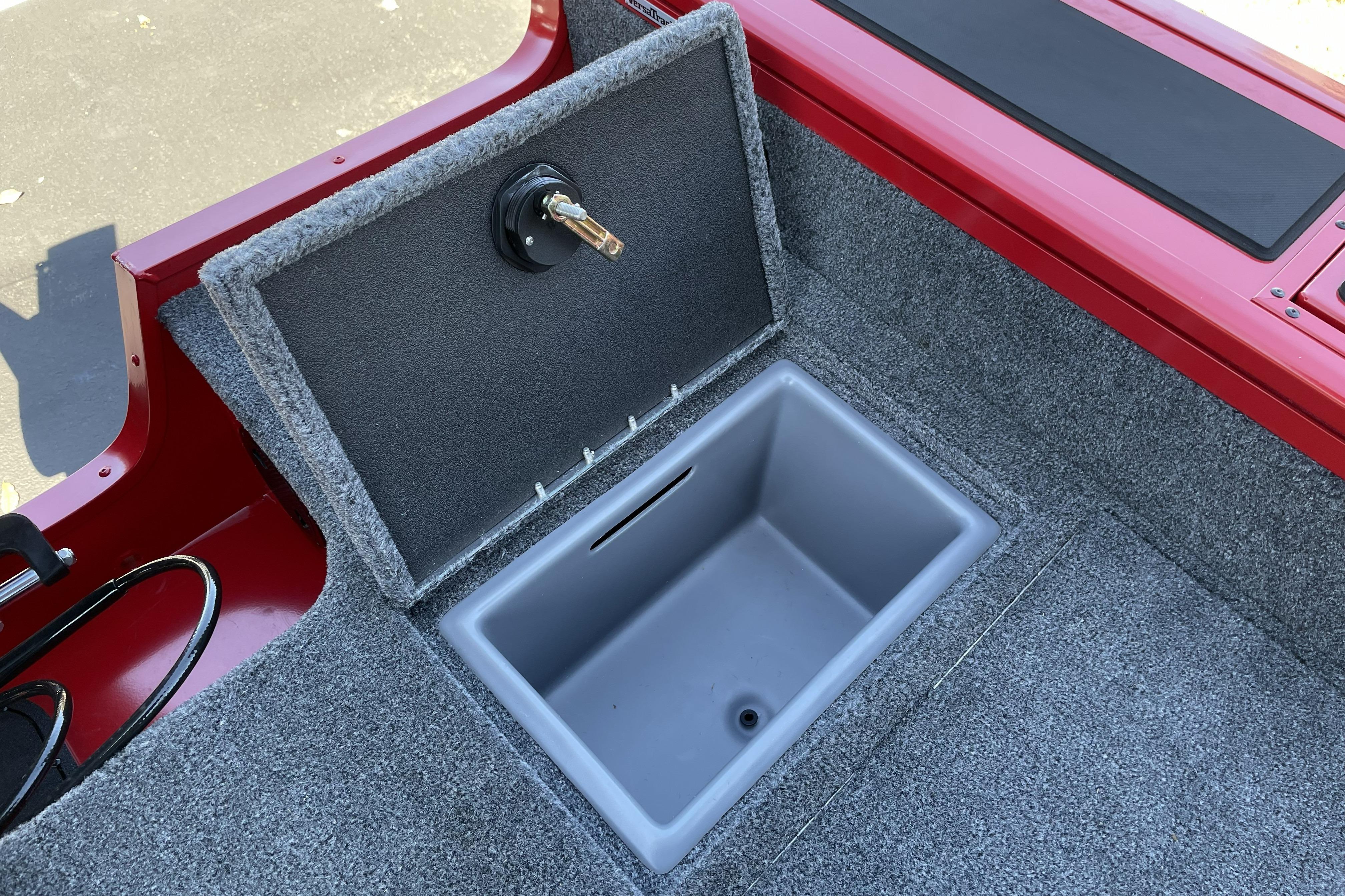 2026 Tracker Targa V-18 WT boat storage compartment with open lid, featuring gray interior.