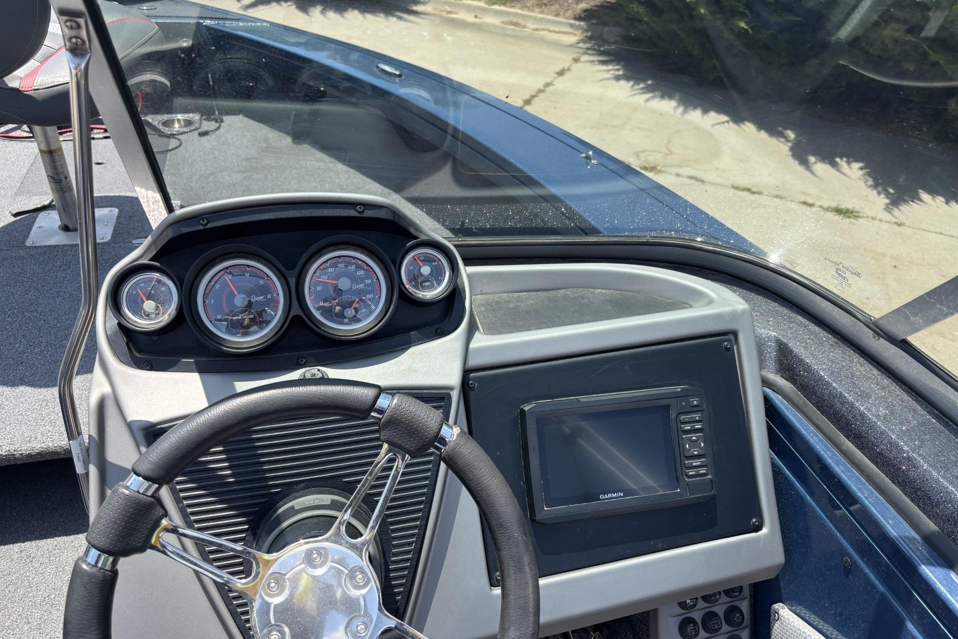 2021 Ranger VX1788 WT boat dashboard with steering wheel and navigation display.