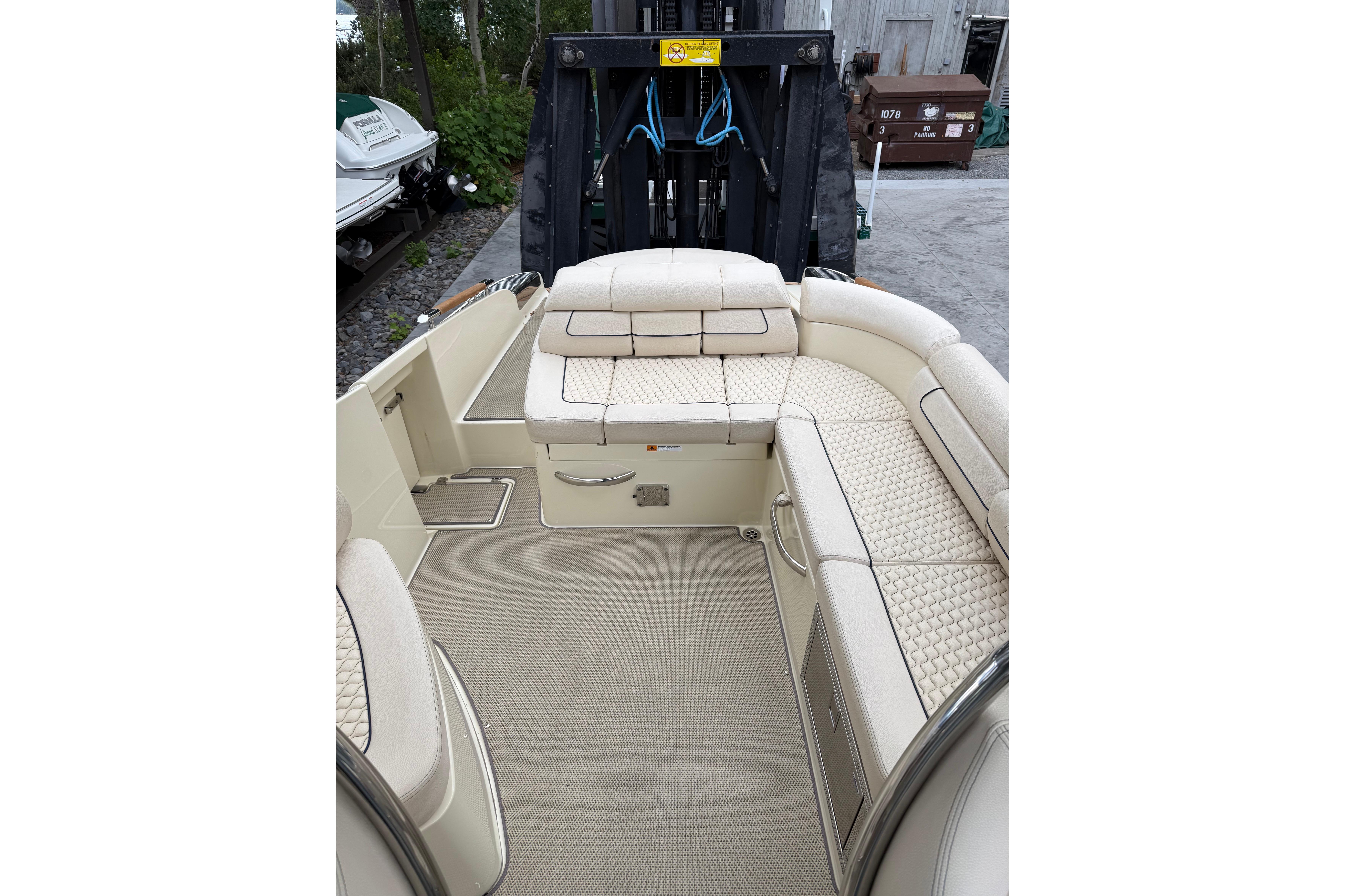 2019 Chris-Craft Launch 28 GT interior with beige seating and elegant design.