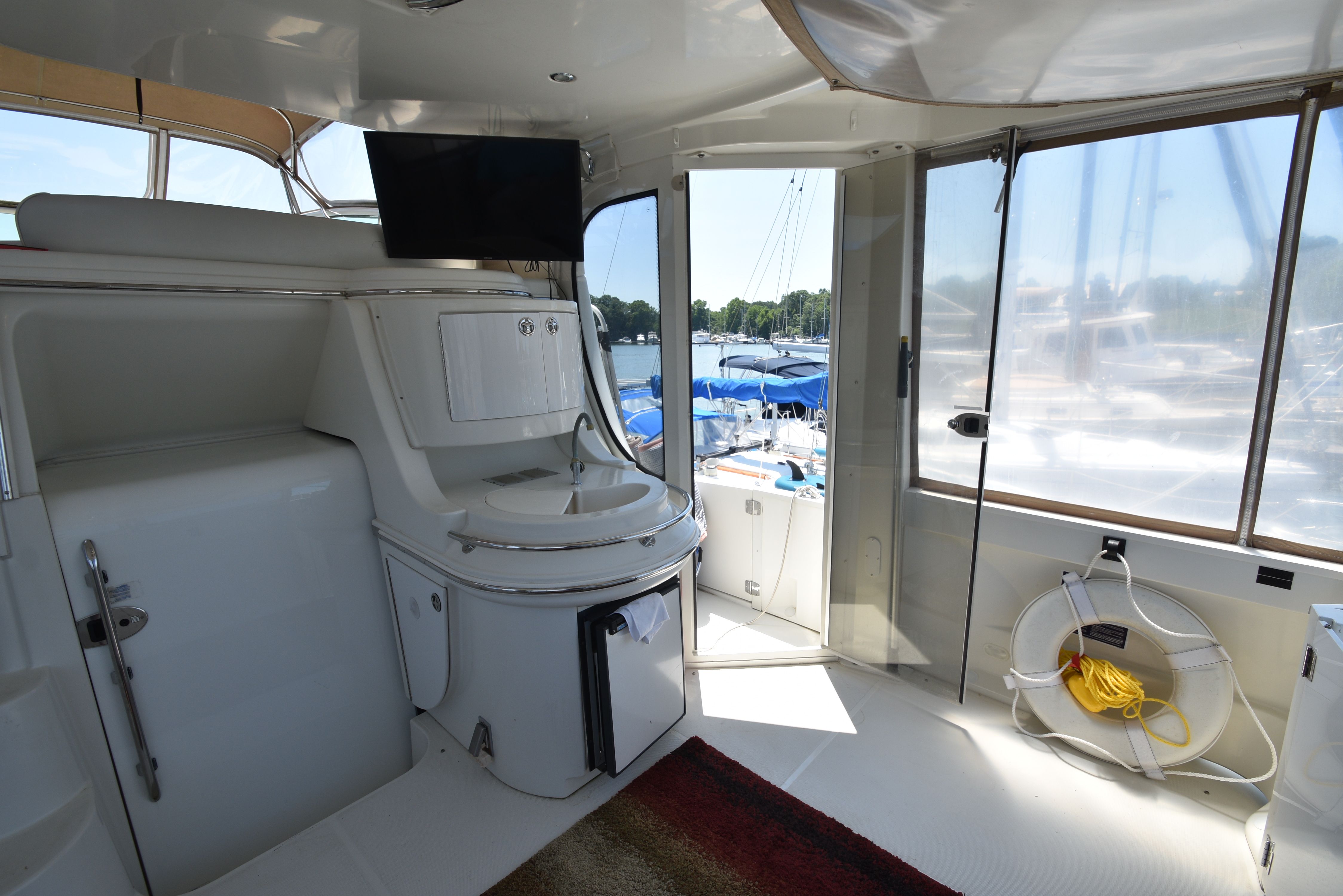 Interior of a 2004 Carver 466 Motor Yacht with a view of the marina.