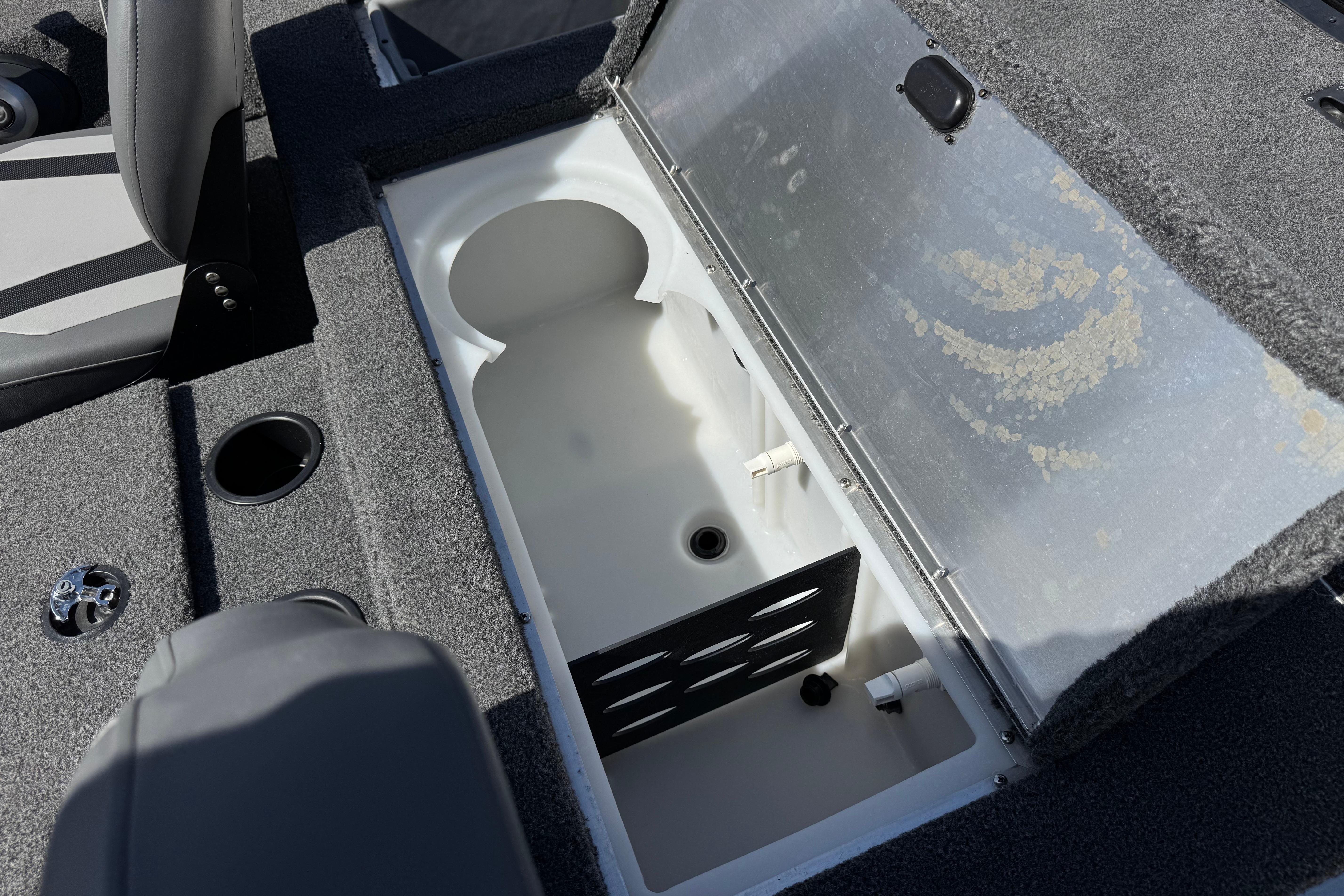 2024 Lowe Stinger 175 boat interior with open storage compartment.